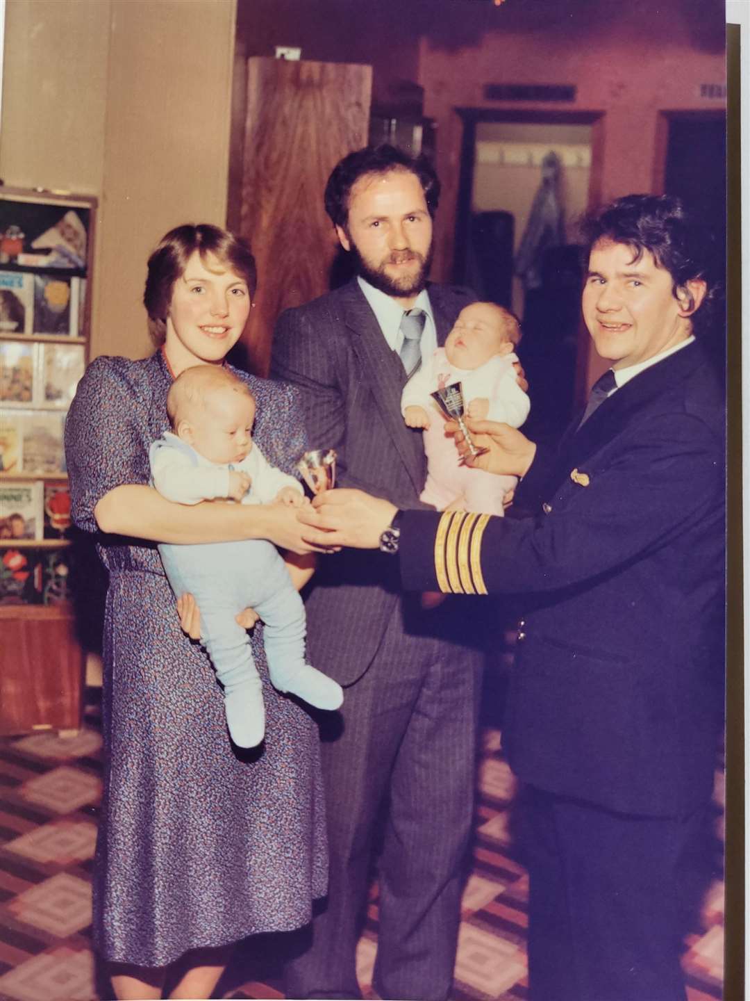 The Henderson family with captain Malcolm Bray.