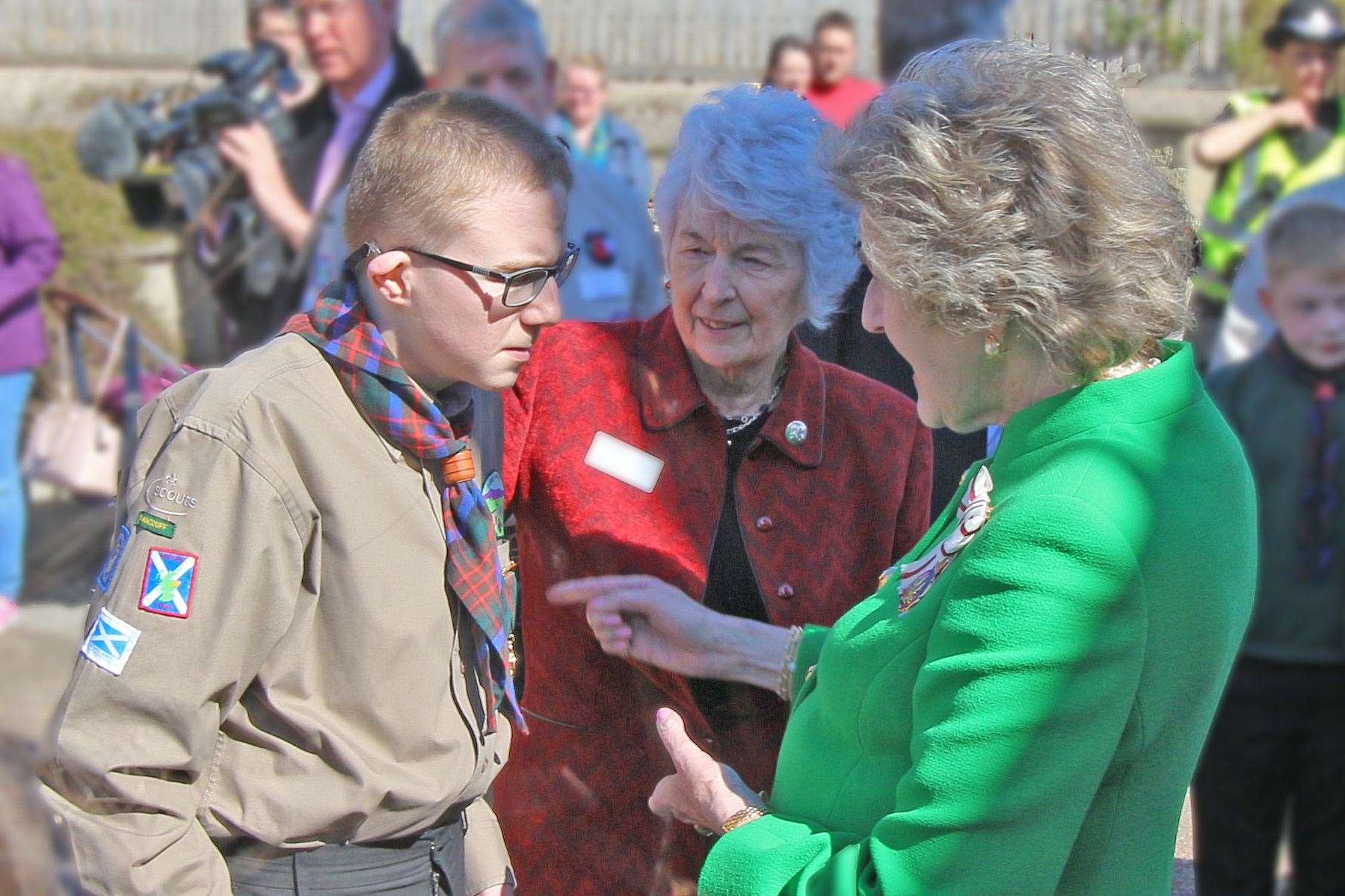 Explorer Scout Mark Smith is presented with the Medal for Meritorious Conduct by Lord Lieutenant of Banffshire Clare Russell.