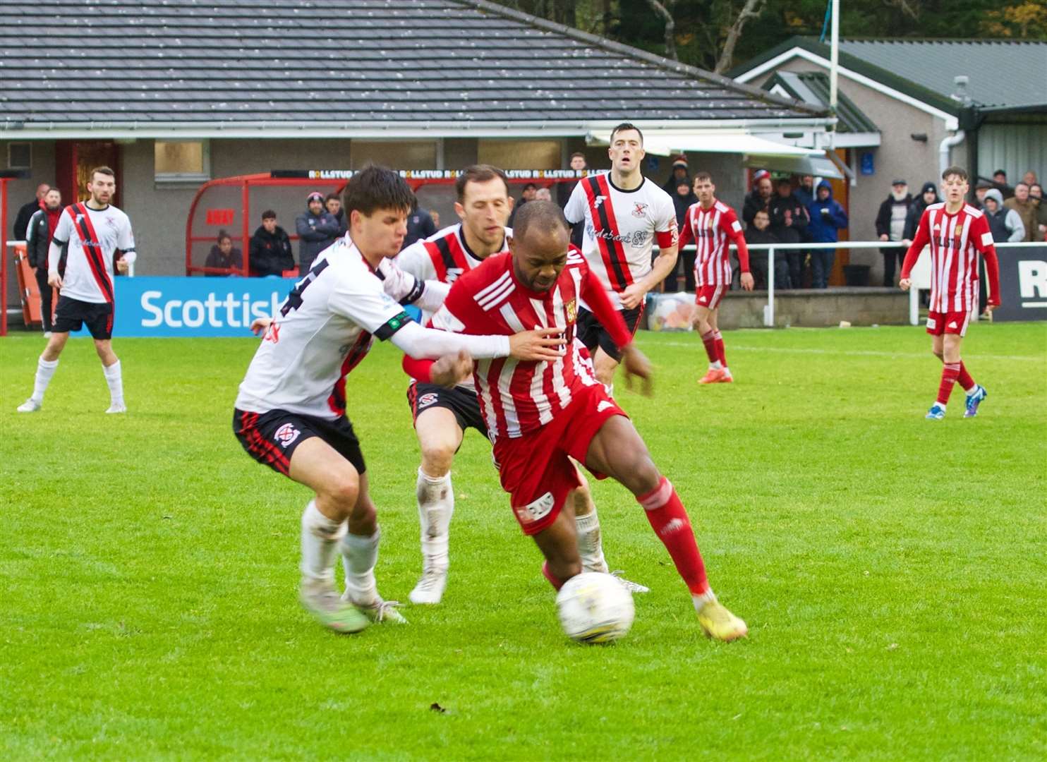 Formartine's Julian Wade slips past the Clydebank defenders. Picture: Phil Harman.