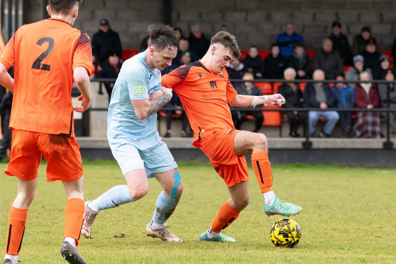 Rothes' Matthew McConachie blocks the ball from Keith's Michael Taylor. ..Rothes F.C. (0) v Keith F.C. (0) at Mackessack Park, Rothes, Highland Football League 23/24...Picture: Beth Taylor.