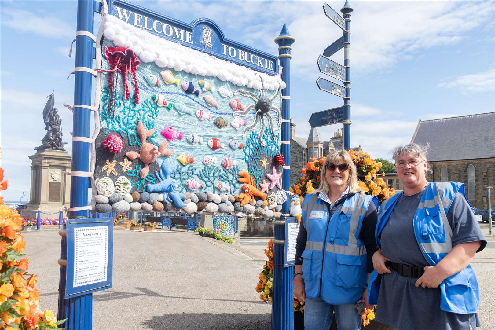 Sandra Simpson (left) and Maria Chambers from Crafty Roots, Buckie's Roots' crafters group, showcase the Beautiful Sea Life panel at Cluny Square in July. Picture: Beth Taylor