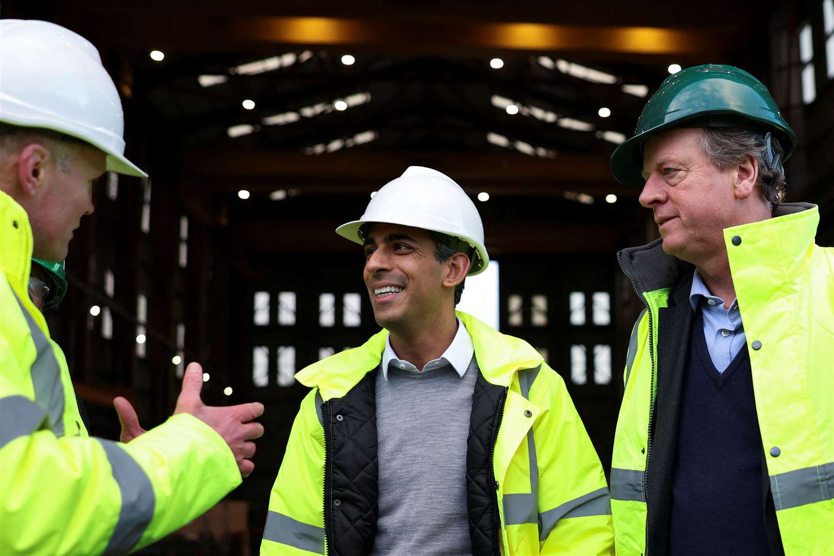 Prime Minister Rishi Sunak, centre, visited the Port of Cromarty Firth in northern Scotland on Friday (Russell Cheyne/PA)
