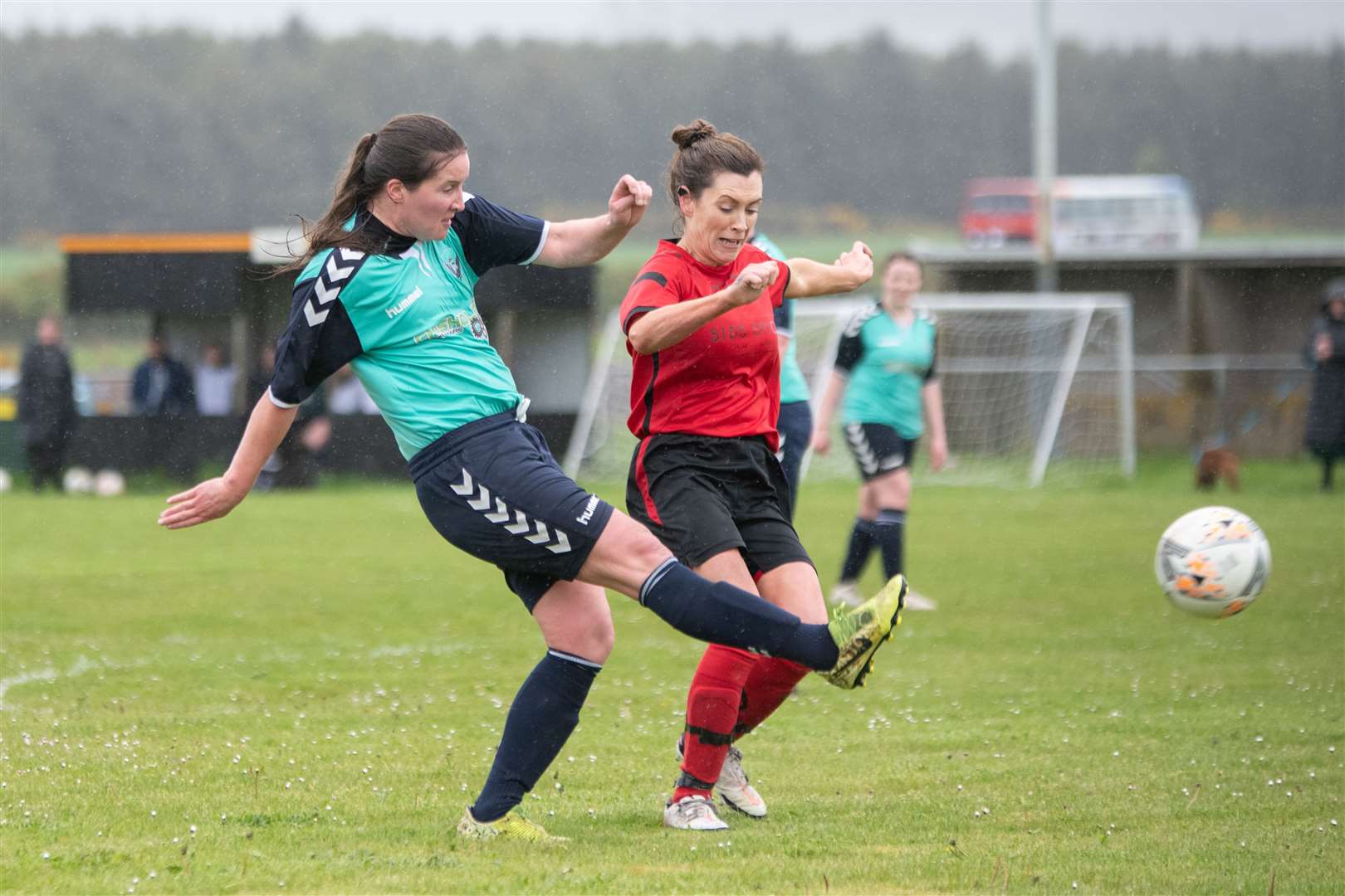 Buckie Ladies' Lorna Young crosses before Brora's Melissa Fox gets the chance to tackle...Buckie Ladies FC (8) vs Brora Rangers Ladies FC (1) - SWF Highlands and Islands League - Gordon Park, Portgordon 14/05/2023...Picture: Daniel Forsyth..