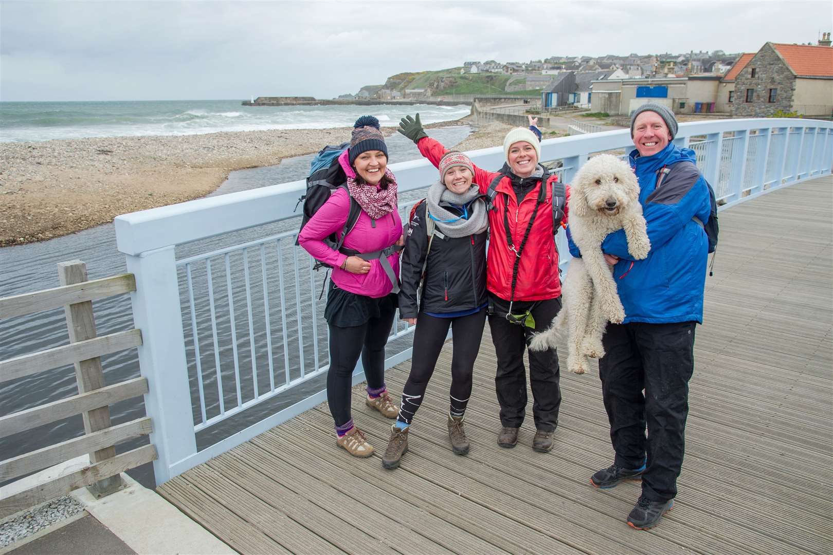 Pausing for a breather at Cullen are (from left) Anete Krievkalne, Bryony Strange, Stephanie McGuiness and Brian McGuiness along with their Golden Doodle Luna. Picture: Daniel Forsyth. Image No.043342.