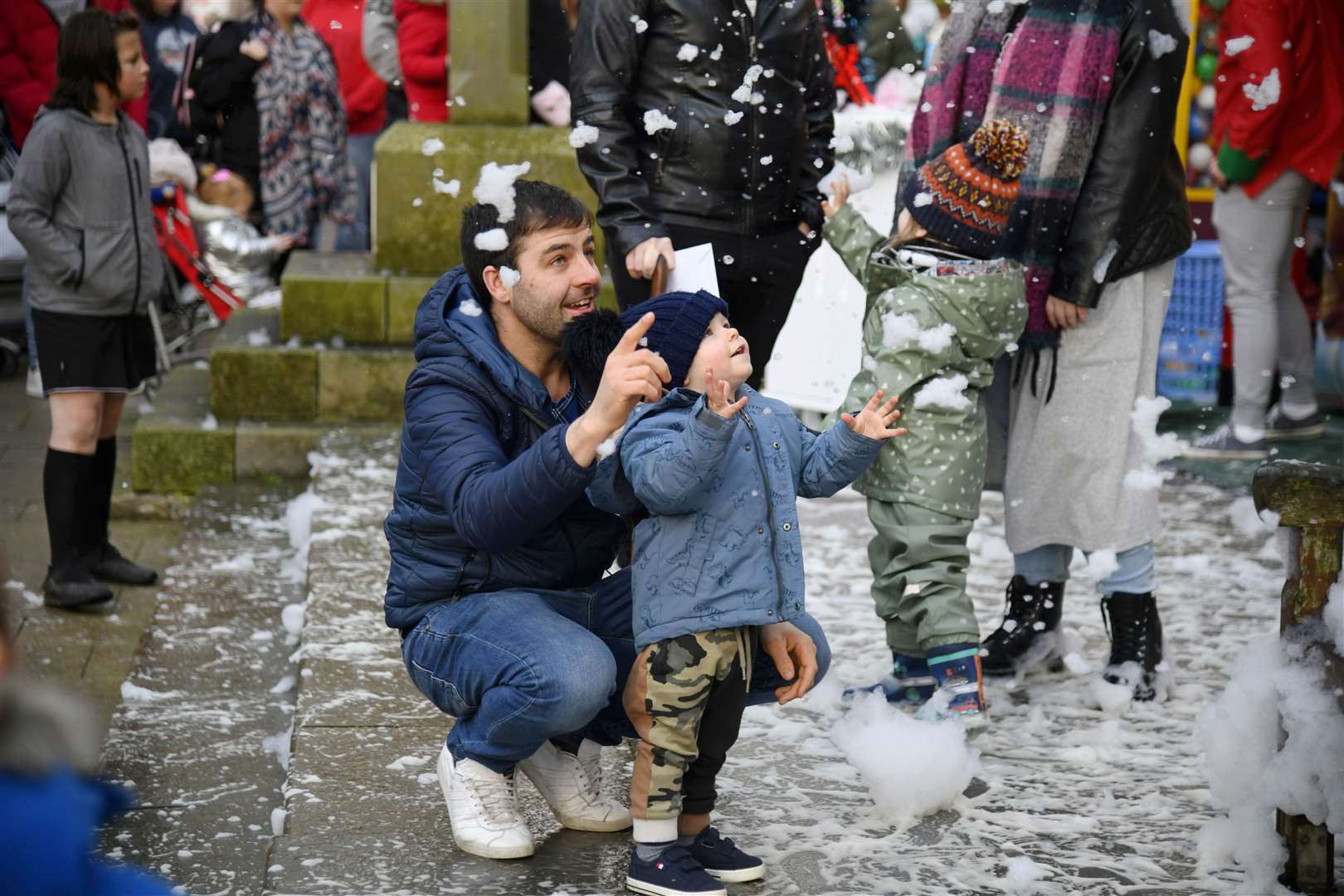 Mark and Finlay West enjoying the foam machine at the Christmas Cracker. ..Banff Christmas Cracker, 2022...Picture: Beth Taylor.