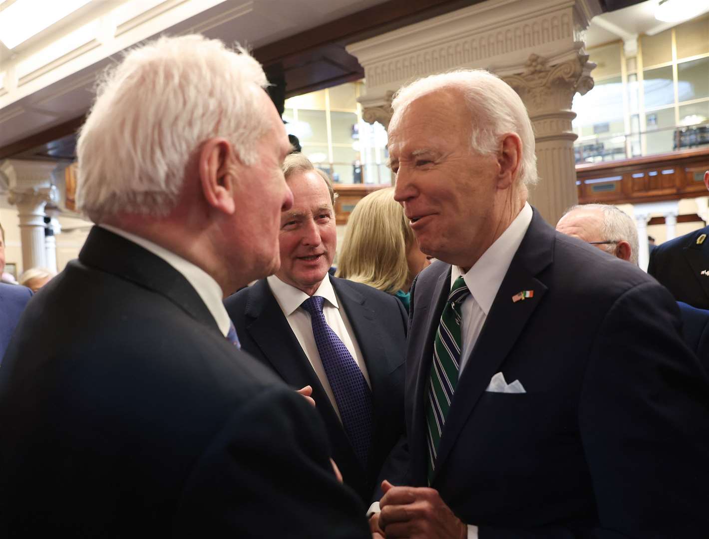 Joe Biden chats with former Irish premiers Bertie Ahern and Enda Kenny (Tony Maxwell/PA)