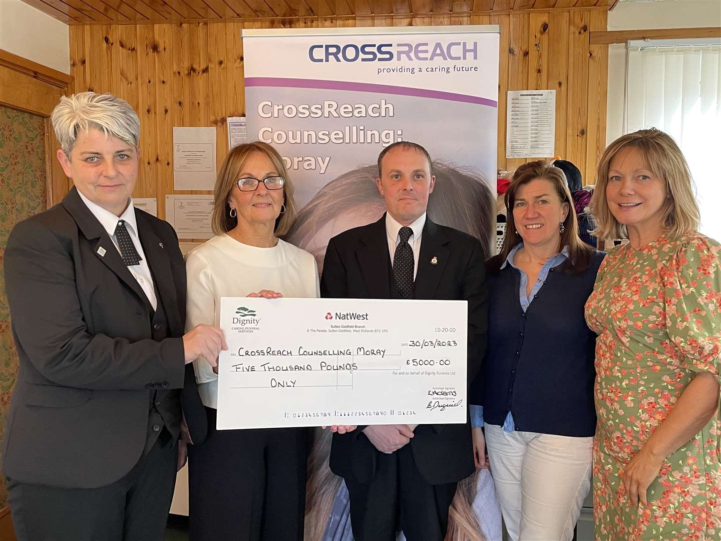 Caroline Duguid (left) and David Guthrie (middle) from William Mair presented the CrossReach team with the £5,000 cheque.