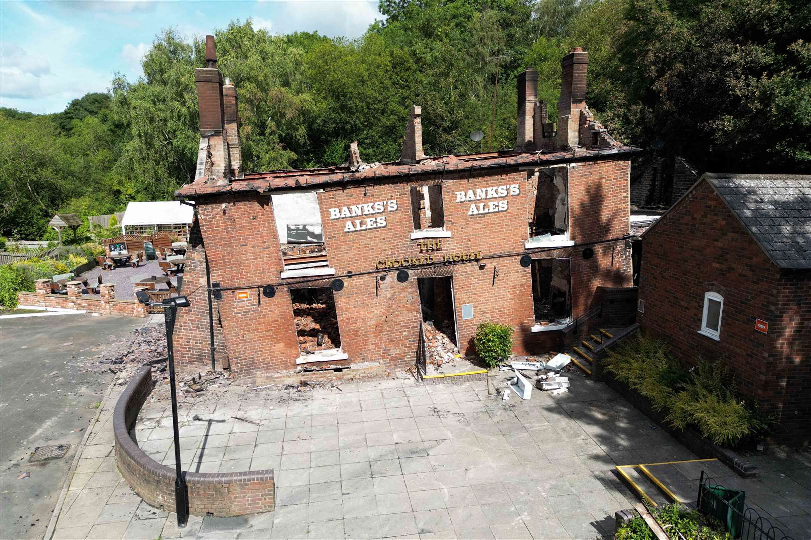 The burnt out remains of the historic pub before it was demolished (Jacob King/PA)