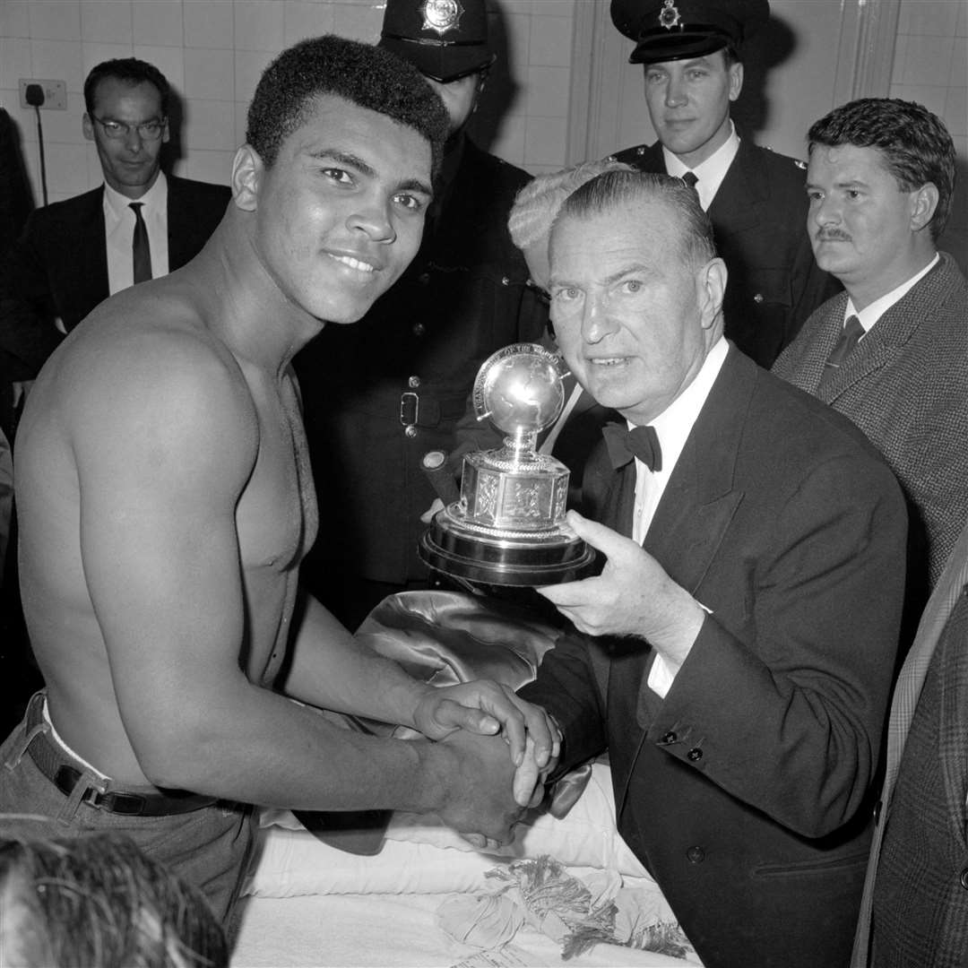 Muhammad Ali in his dressing room after retaining his world title by beating Henry Cooper (PA)