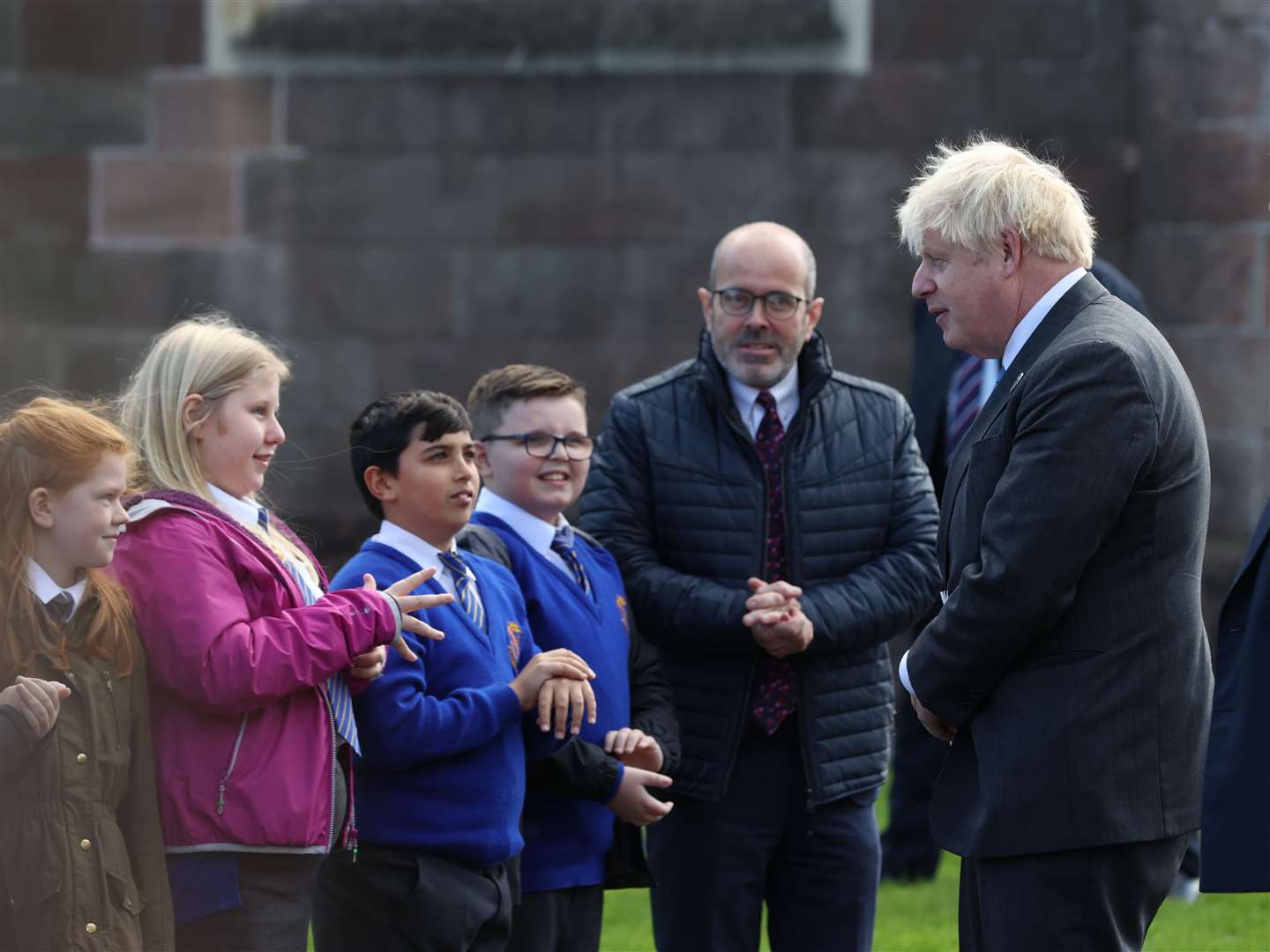Prime Minister Boris Johnson (left) talks to children after a service to mark the centenary of Northern Ireland at St Patrick’s Cathedral in Armagh (Liam McBurney/PA)