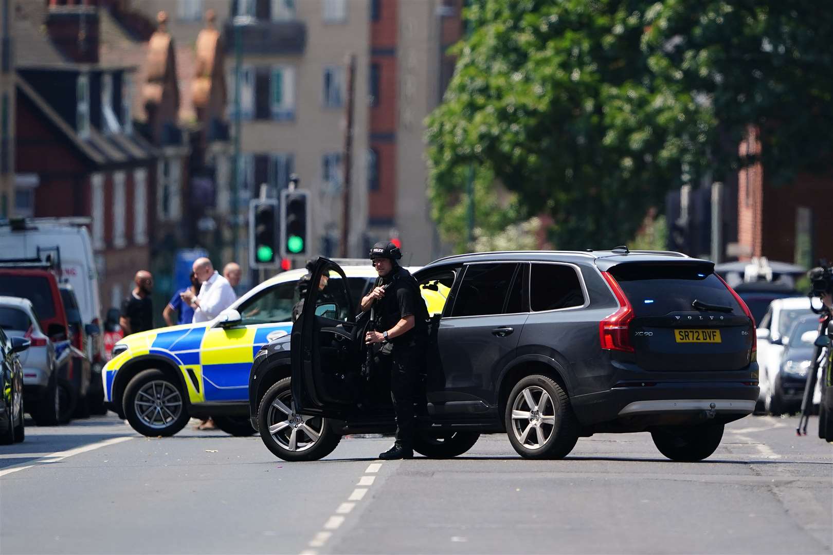An armed police officer on Ilkeston Road in Nottingham (Zac Goodwin/PA)