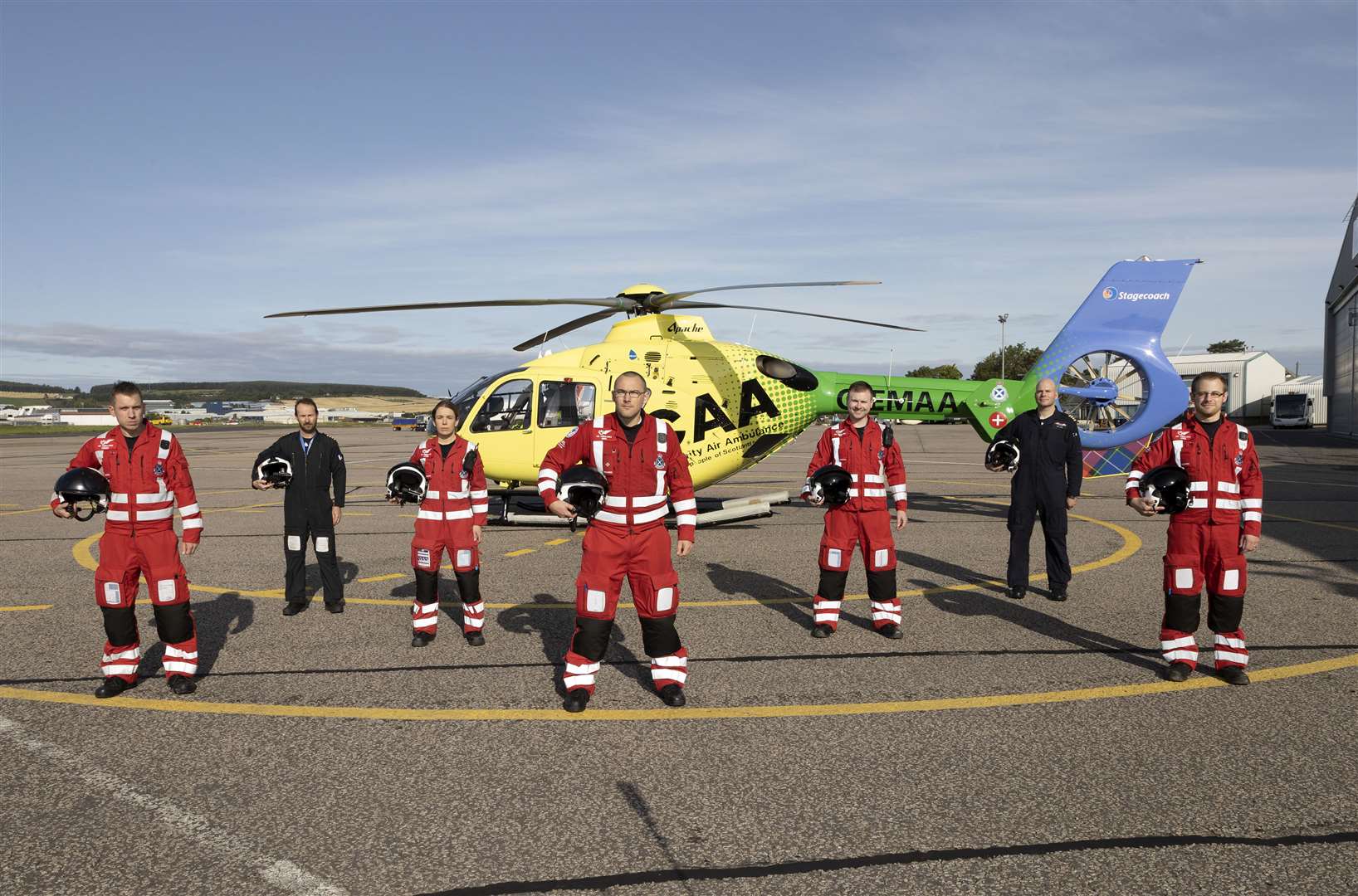 Scotland’s Charity Air Ambulance Base, Aberdeen (SCAA) home to Helimed 79 Pictured from left, Chriss Doyle (paramedic), Captain Jon Stupart (pilot), Laura McAllister (paramedic), Ewan Littlejohn (lead paramedic), Rich Forte (paramedic), Captain Pete Winn (pilot) and Owen McLauchlan (paramedic). Picture: Graeme Hart.