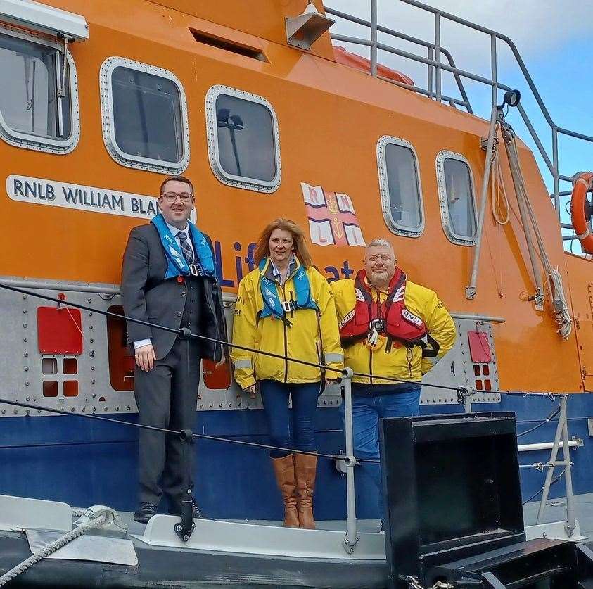 Barry Robertson (left), business leader of Crematorium and Memorial Group with Fiona Watt, Buckie RNLI lifeboat visits officer, and lifeboat coxswain Davie Grant after presenting a cheque for £310. Picture: Buckie RNLI