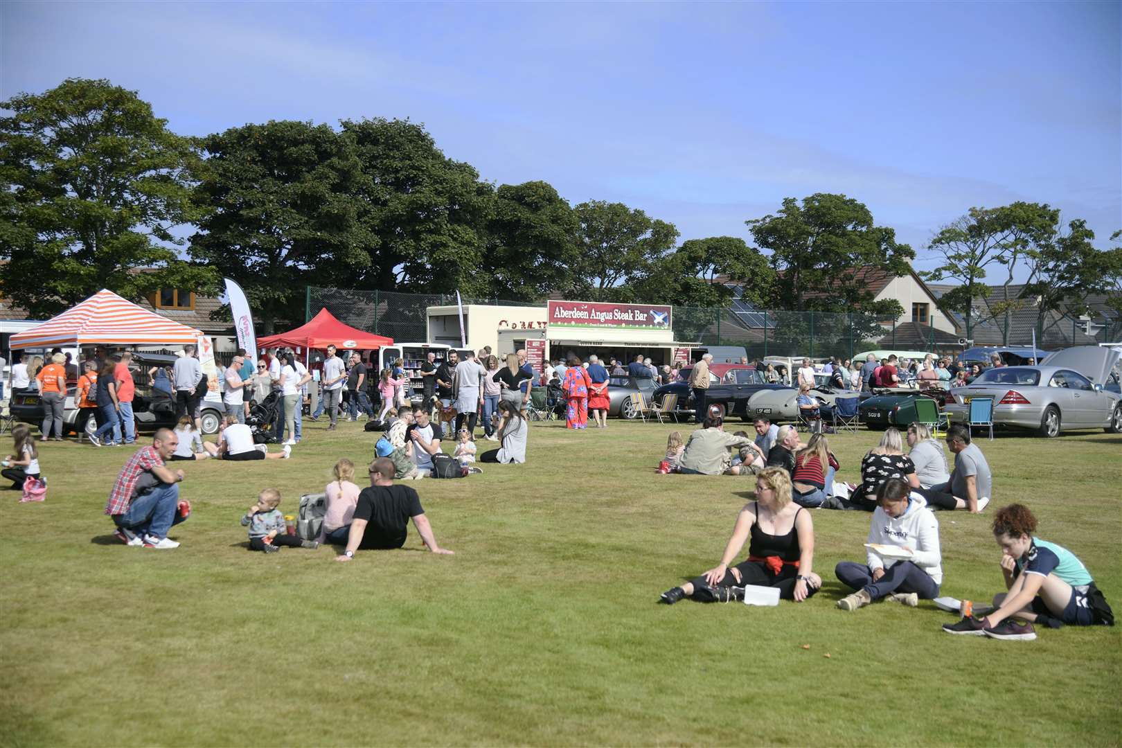 The crowd enjoying the sun and array of cars on show...2022 Buckie Classic Car Show. ..Picture: Beth Taylor.