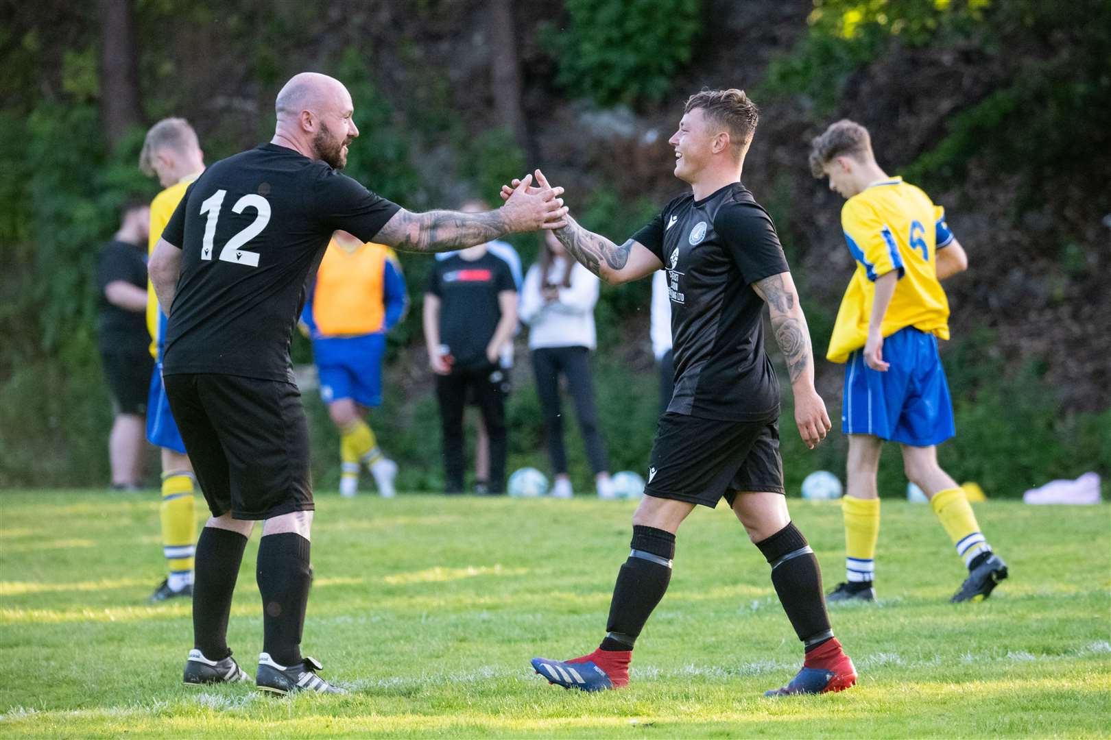 Craigellachie's Bradley Mills is congratulated by Steven Chalmers after he slotted home a penalty for the home side...Picture: Daniel Forsyth..