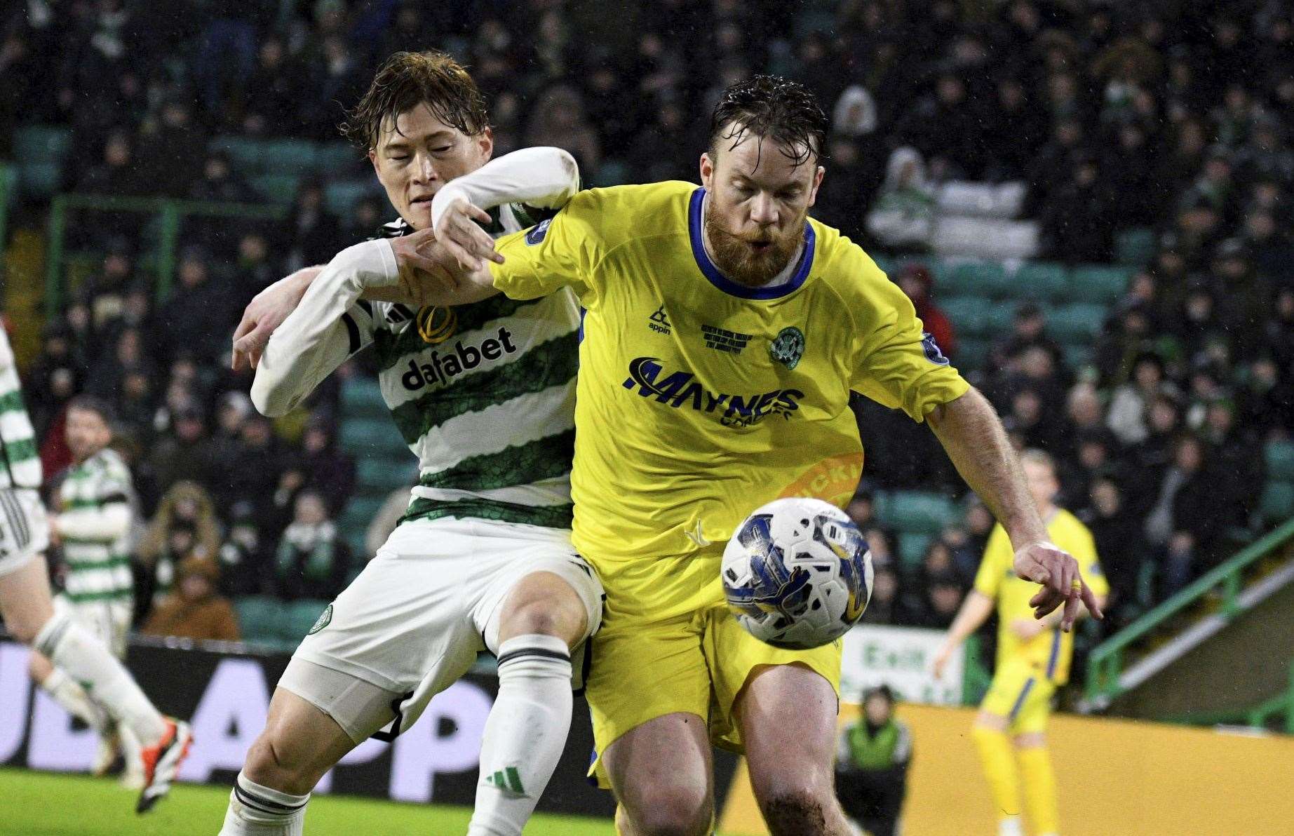Buckie Thistle's Hamish Munro battles with Celtic's Kyogo Furuhashi. Picture: Daniel Forsyth