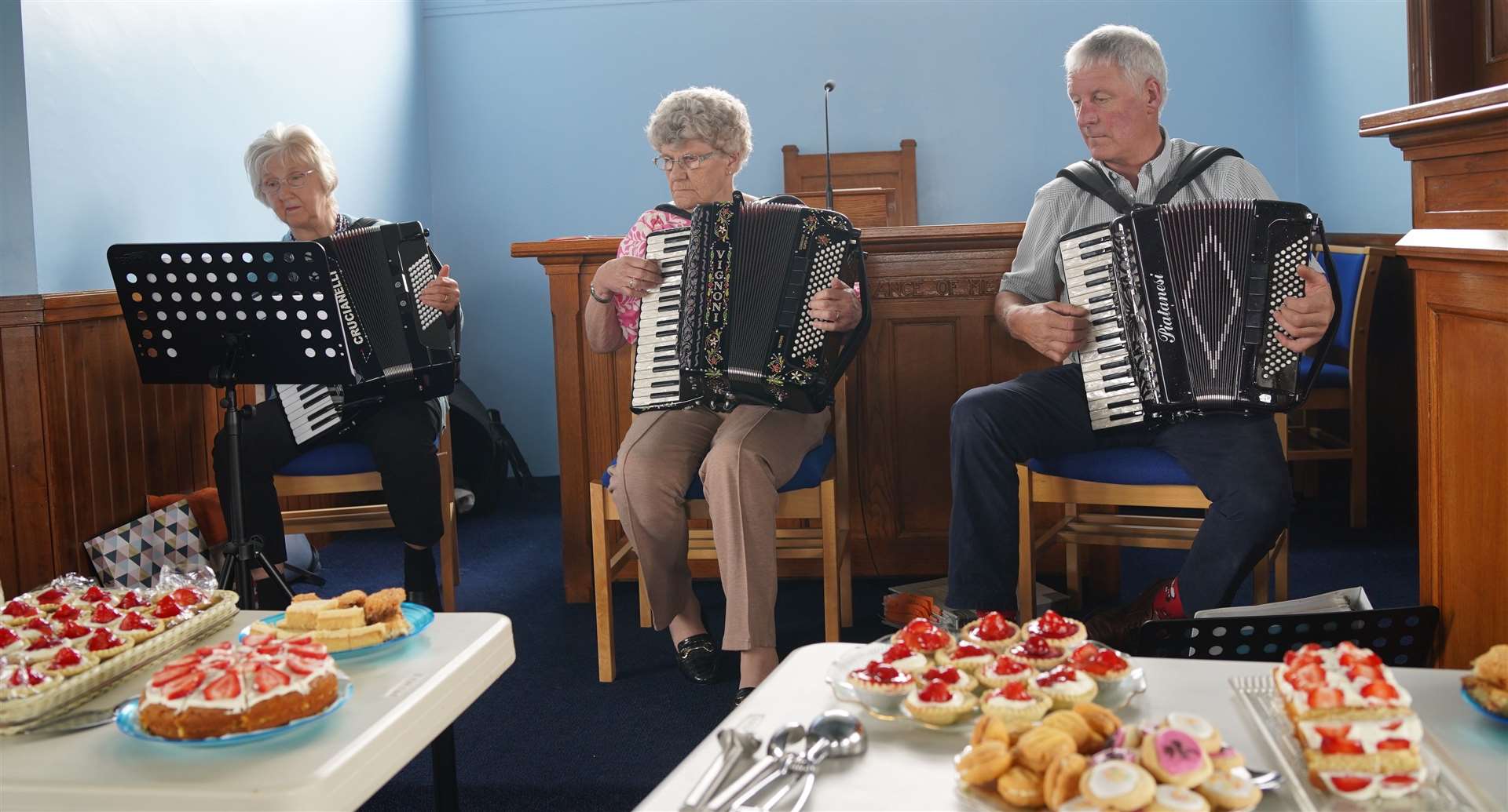 Accordionists concentrating on the tune while eyeing up their favourite cake!. Picture: Alistair Forsyth
