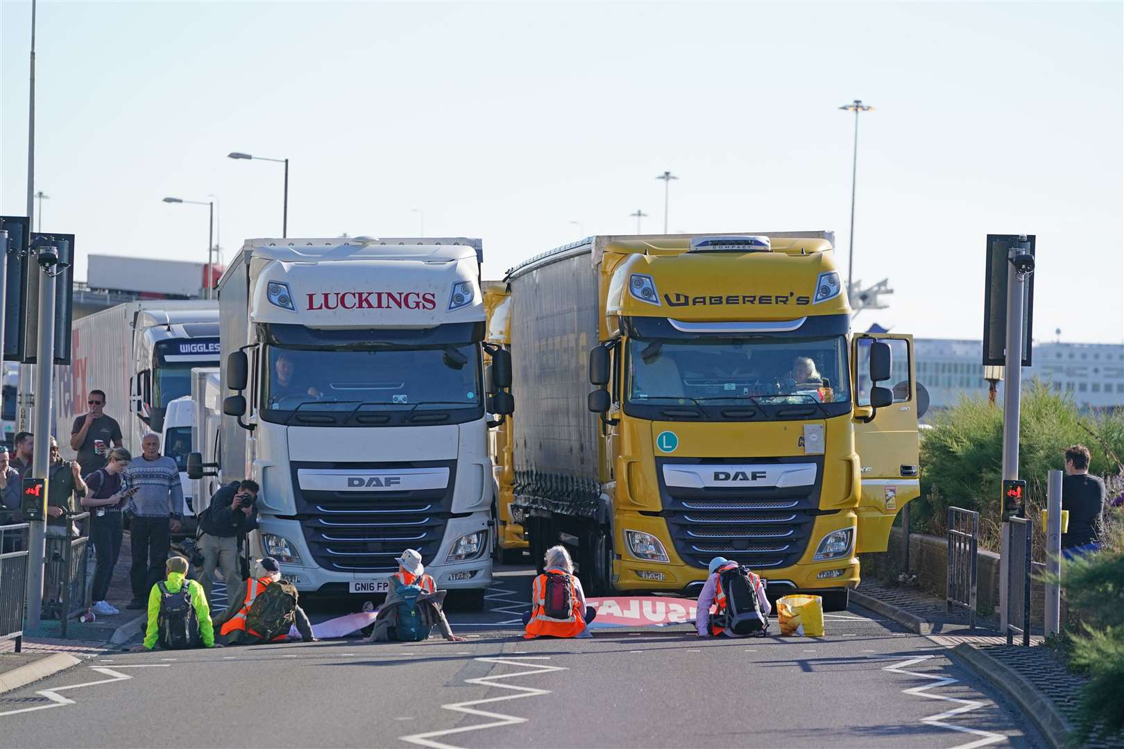 Protesters sit in front of lorries (Gareth Fuller/PA)