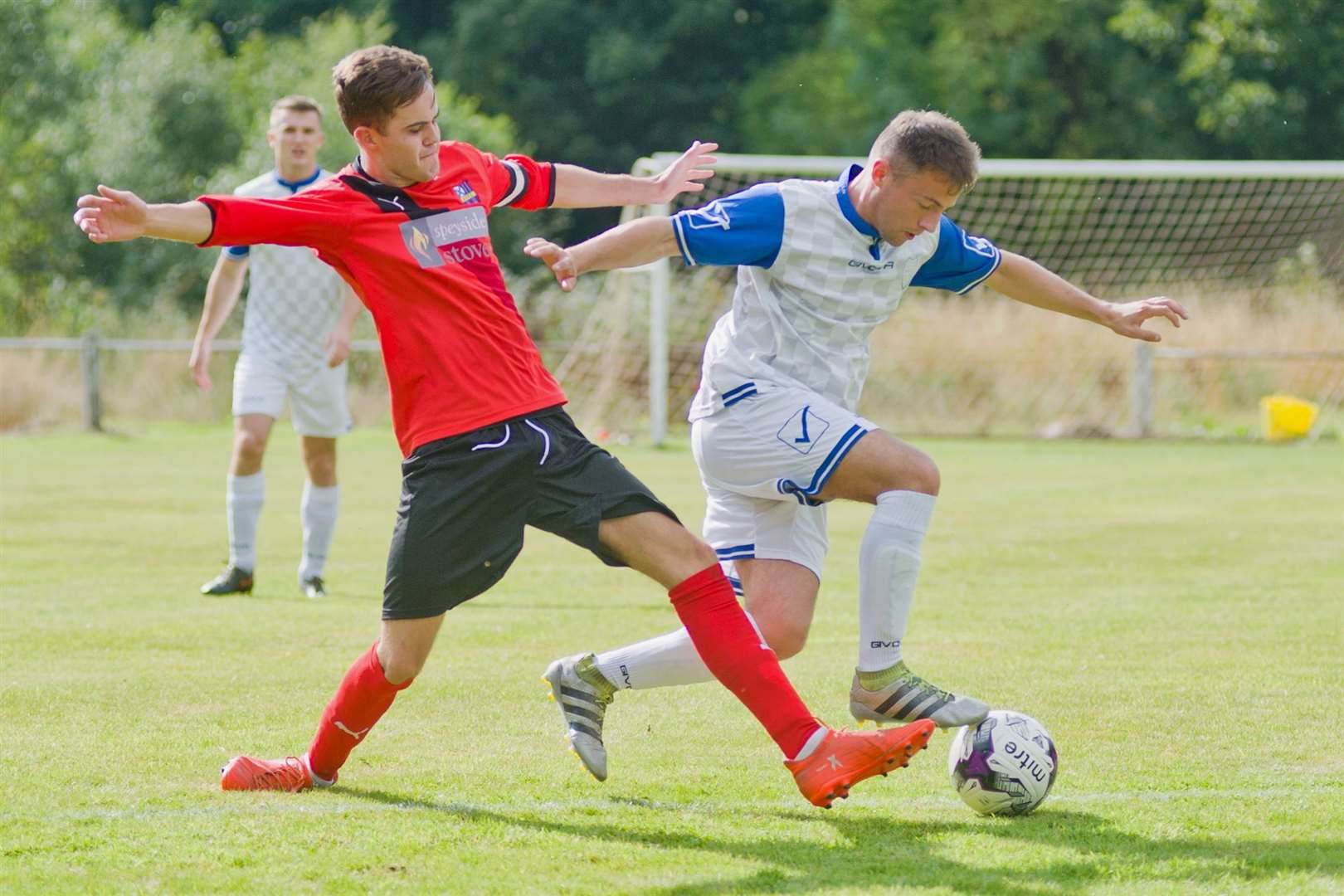 Greig Donald (left) scored a stunning volley for Aberlour in their 5-1 win against Craigellachie. Photo: Daniel Forsyth