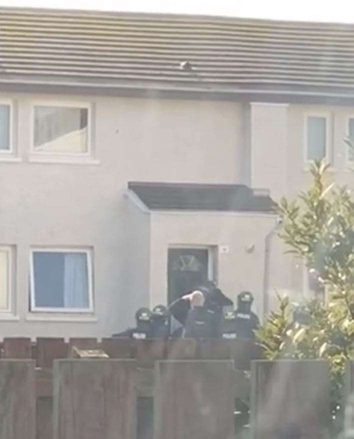 Police force entry into a property on Buckie's Brodie Avenue.