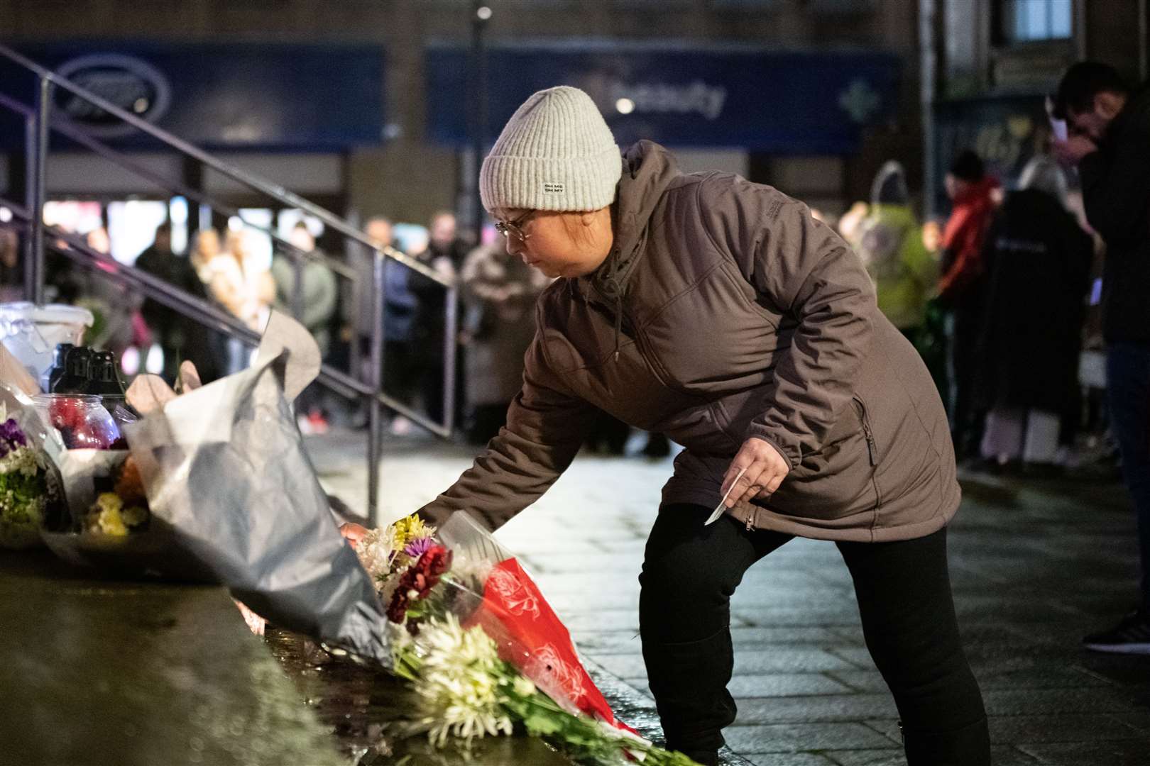 Flowers and candles were laid on the steps of St Giles Church in the centre of Elgin. Picture: Daniel Forsyth
