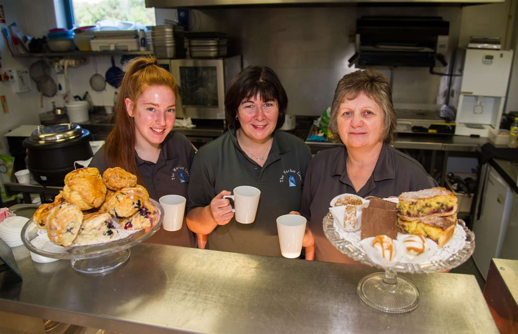 Fiona Forrest centre and Market Cafe team members Vicky Proctor and Catherine Merchant. Picture: Becky Saunderson.