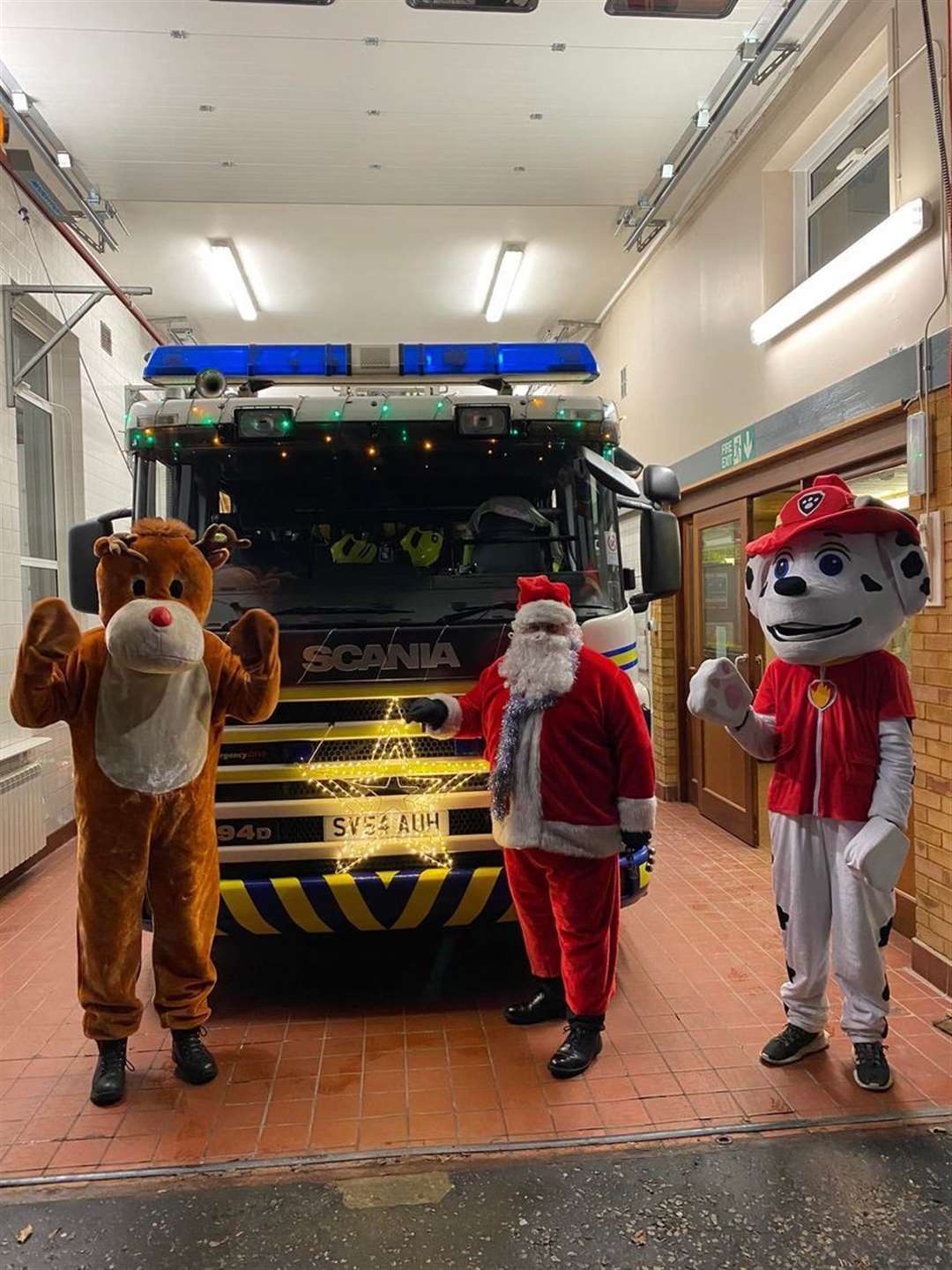 Rudolph, Santa and Marshall the fire dog get ready to hit the streets of Fochabers. Picture: Fochabers fire station