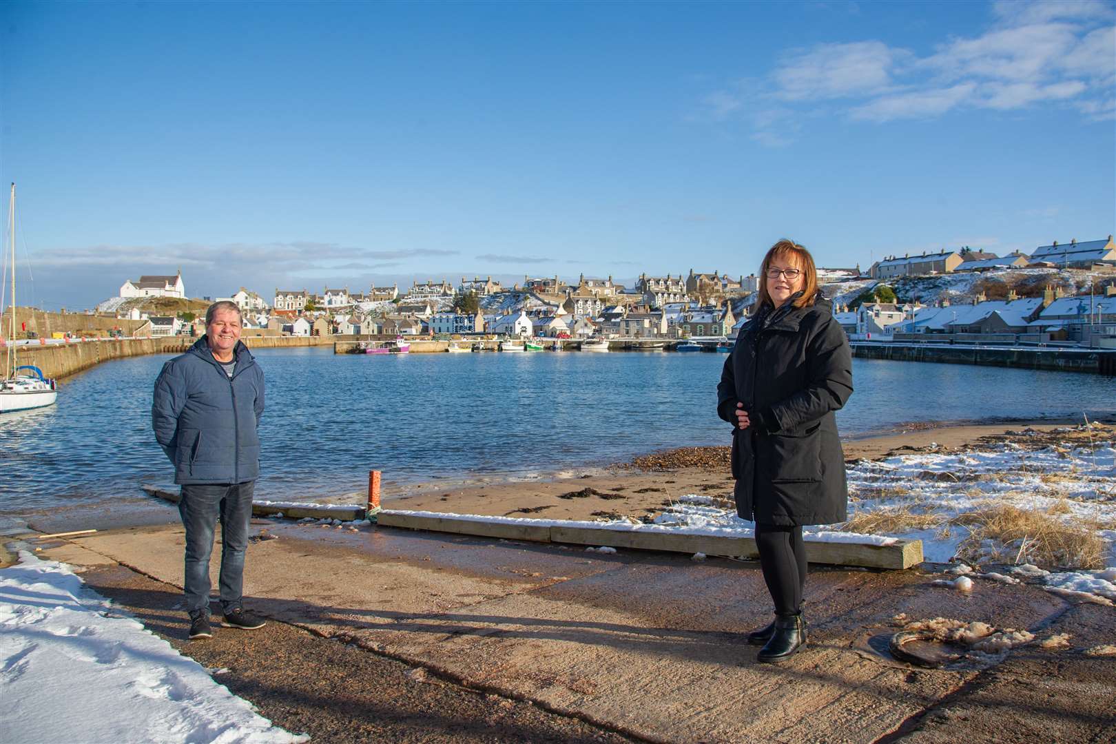 Councillors Gordon Cowie and Sonya Warren have welcomed the removal of the old pontoons at Findochty Harbour.Picture: Daniel Forsyth