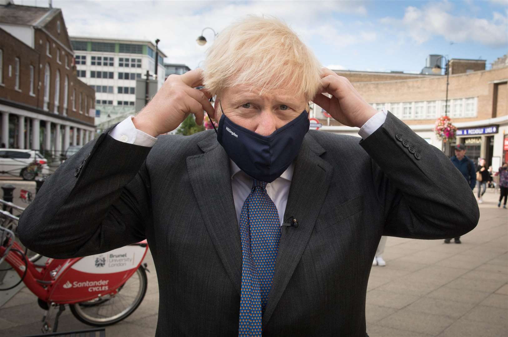 Wearing a mask to meet shoppers and shopkeepers during a visit to his constituency in Uxbridge, west London in September (Stefan Rousseau/PA)