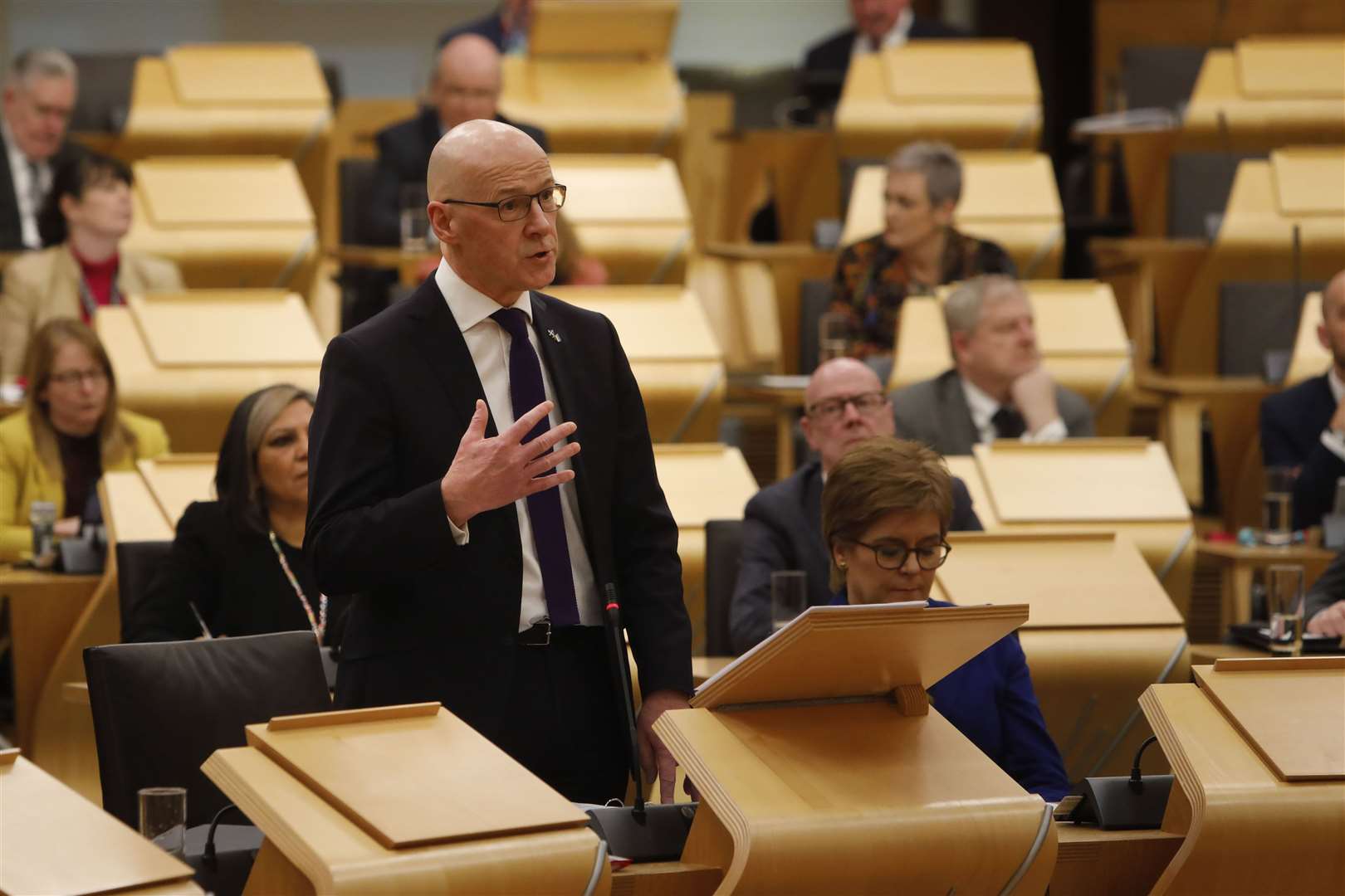 Deputy First Minister John Swinney set out his budget statement in Holyrood on Thursday (Andrew Cowan/Scottish Parliament/PA)