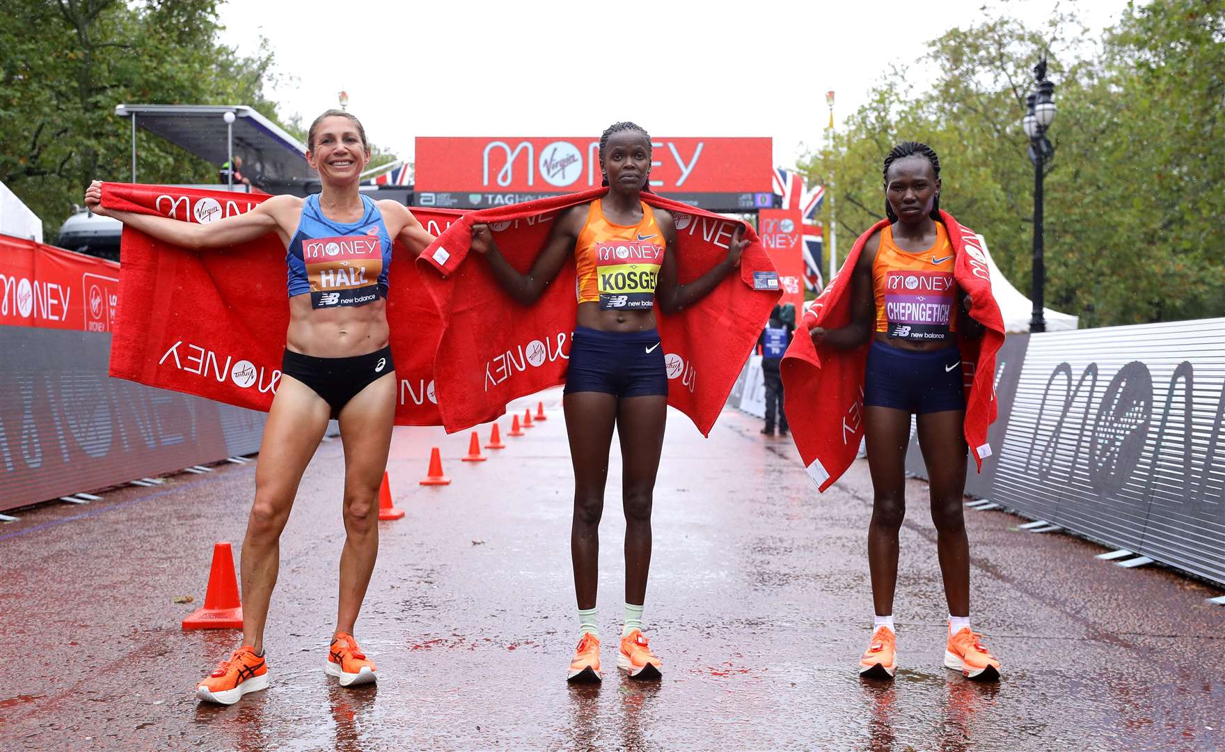 Kenya’s Brigid Kosgei (centre) celebrates winning the elite women’s race alongside second-placed Sara Hall from the USA (left) and Kenya’s Ruth Chepngetich, who came third (Richard Heathcoate/PA)