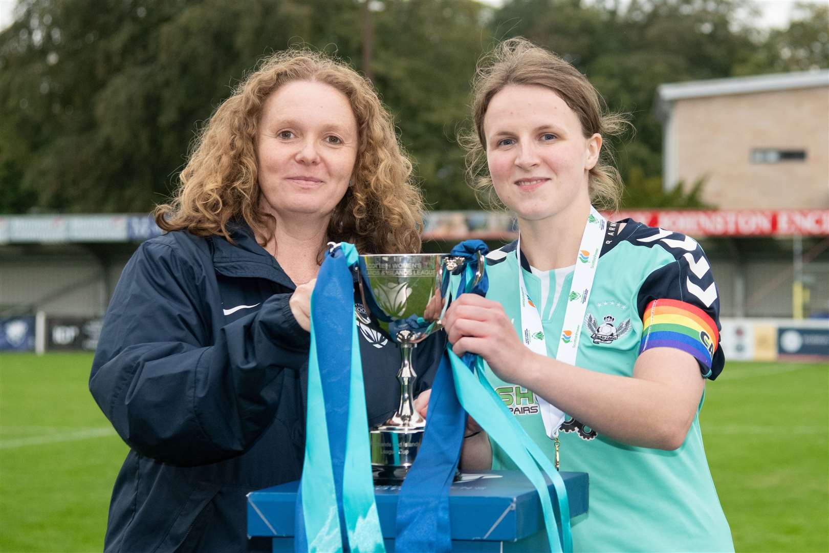Vivienne MacLaren, chair of the Scottish Women's Football, presents the Highlands and Islands League Cup trophy to Buckie Ladies captain Rebecca McMillan. Picture: Daniel Forsyth