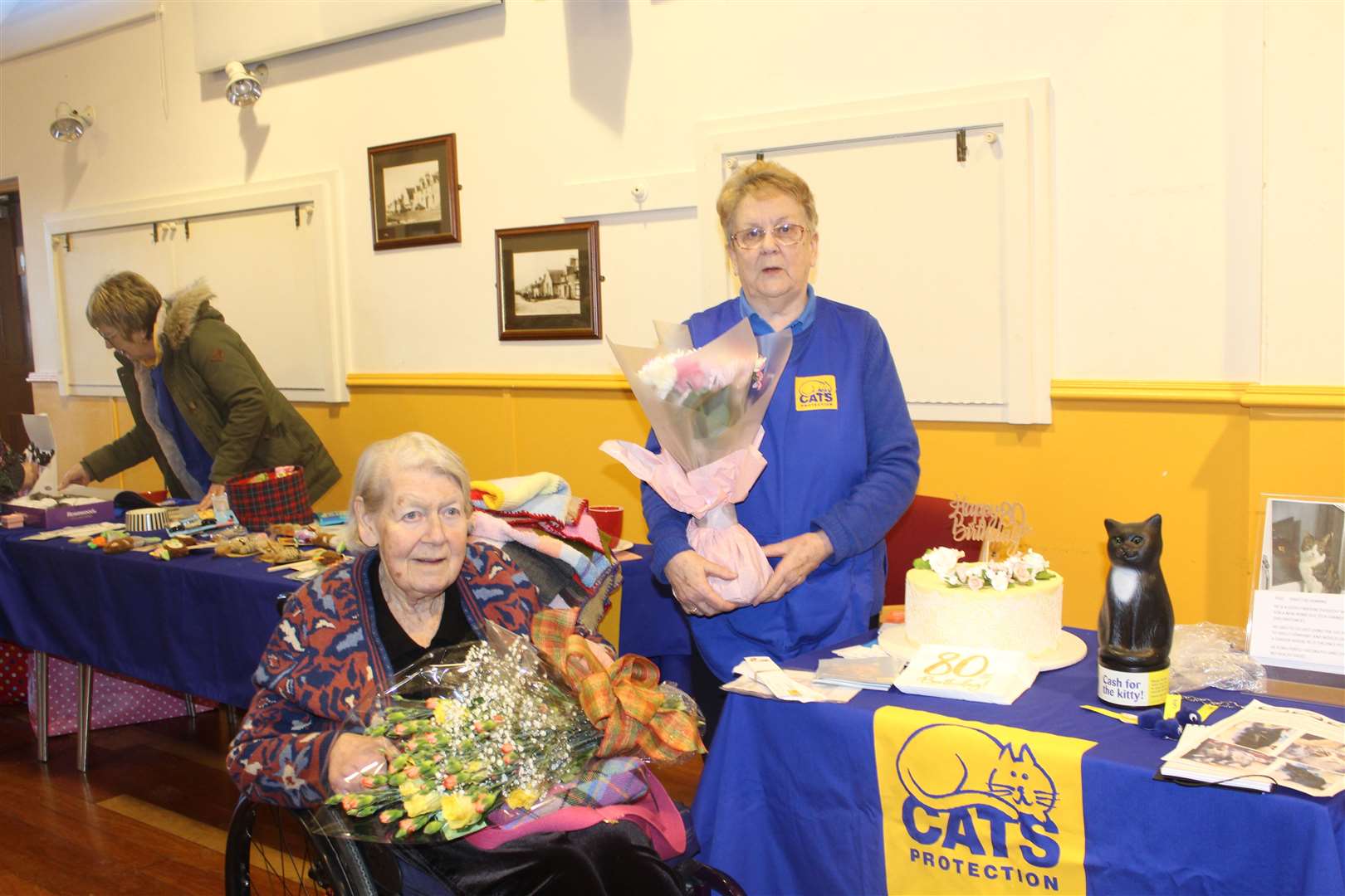 The birthday girl, Leslie Niven, just celebrated her 80th birthday and celebrated her 80th birthday, as branch coordinator Jean Wood congratulated her on Protect Cats Day on Saturday at Kimnai Village Hall.  Photo: Griselda McGregor