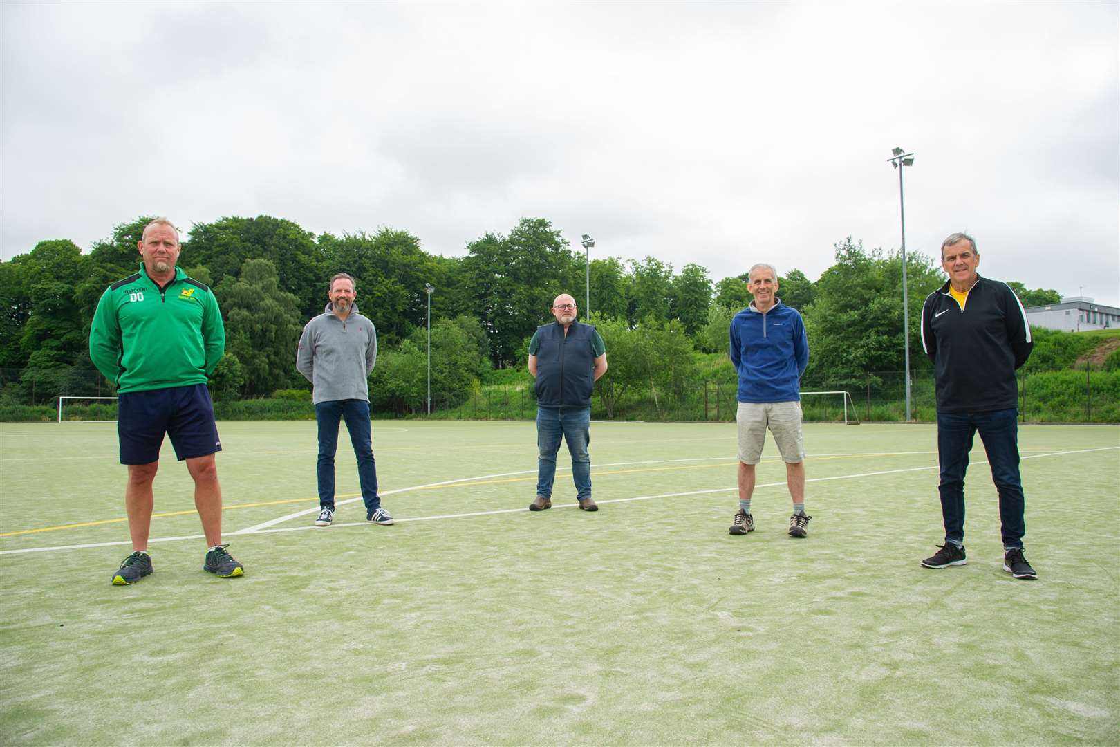 Members of the Huntly Sports Trust, from the left, Chris Lee, Dave Liston, Bruce Murray, Ian Little and Allan Mitchell at the all-weather pitch which is to be overhauled. Picture: Daniel Forsyth.