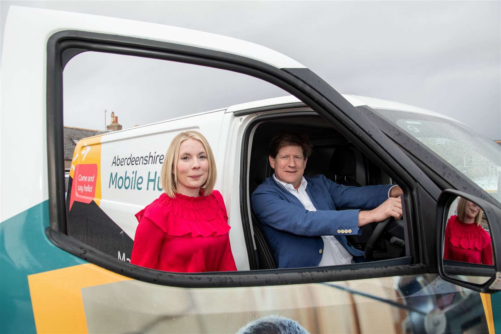 MSP Alexander Burnett in one of the mobile office vans with Hollie Kelly, Project Manager at the E3 Huntly Hub. Picture: Daniel Forsyth.