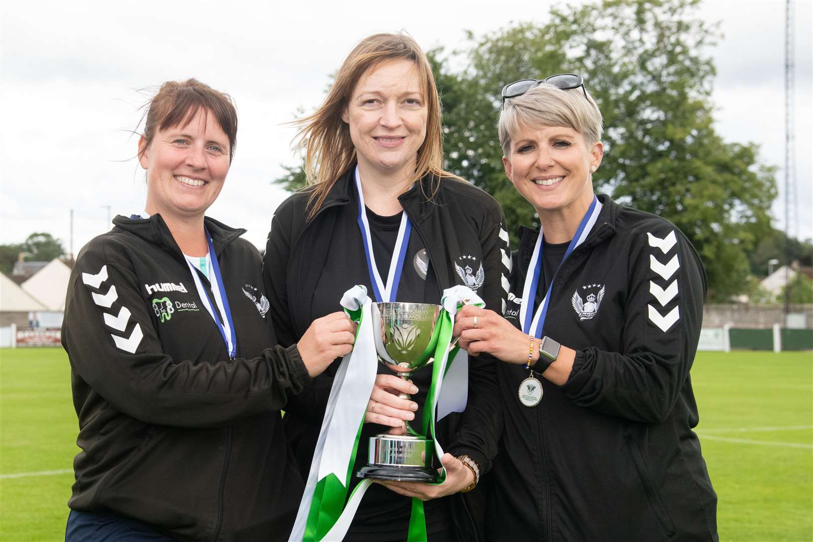 Current Buckie Ladies manager Laura Duncan (left) celebrates winning the League Cup last year along with then manager Mel Smith (centre) and player-coach Kathryn Evans. Picture: Daniel Forsyth