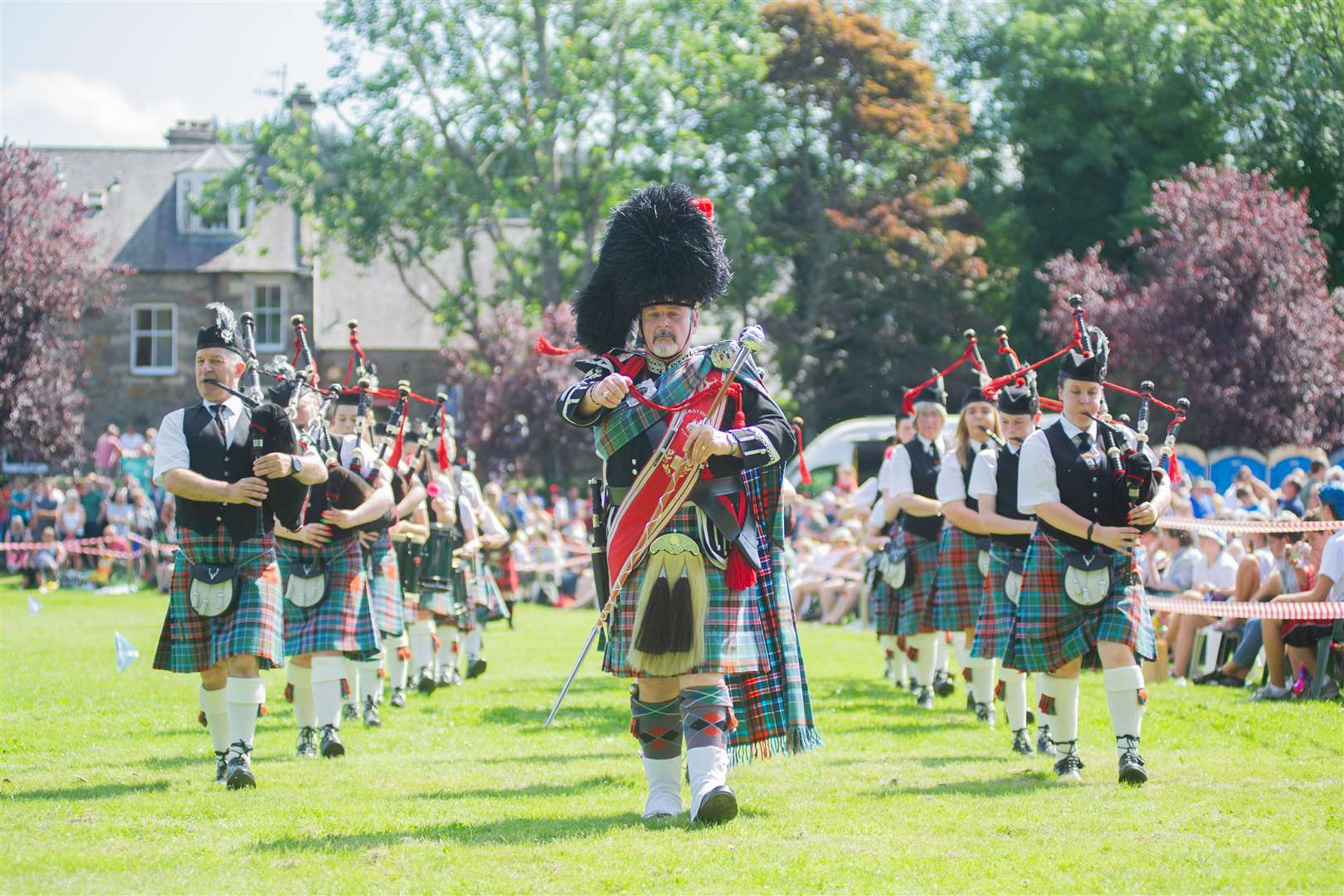 Pipe major Keith Morrison leads Strathisla Pipe Band at the 76th Aberlour Stathspey Highland Games last weekend. Picture: Daniel Forsyth. Image No.044579.