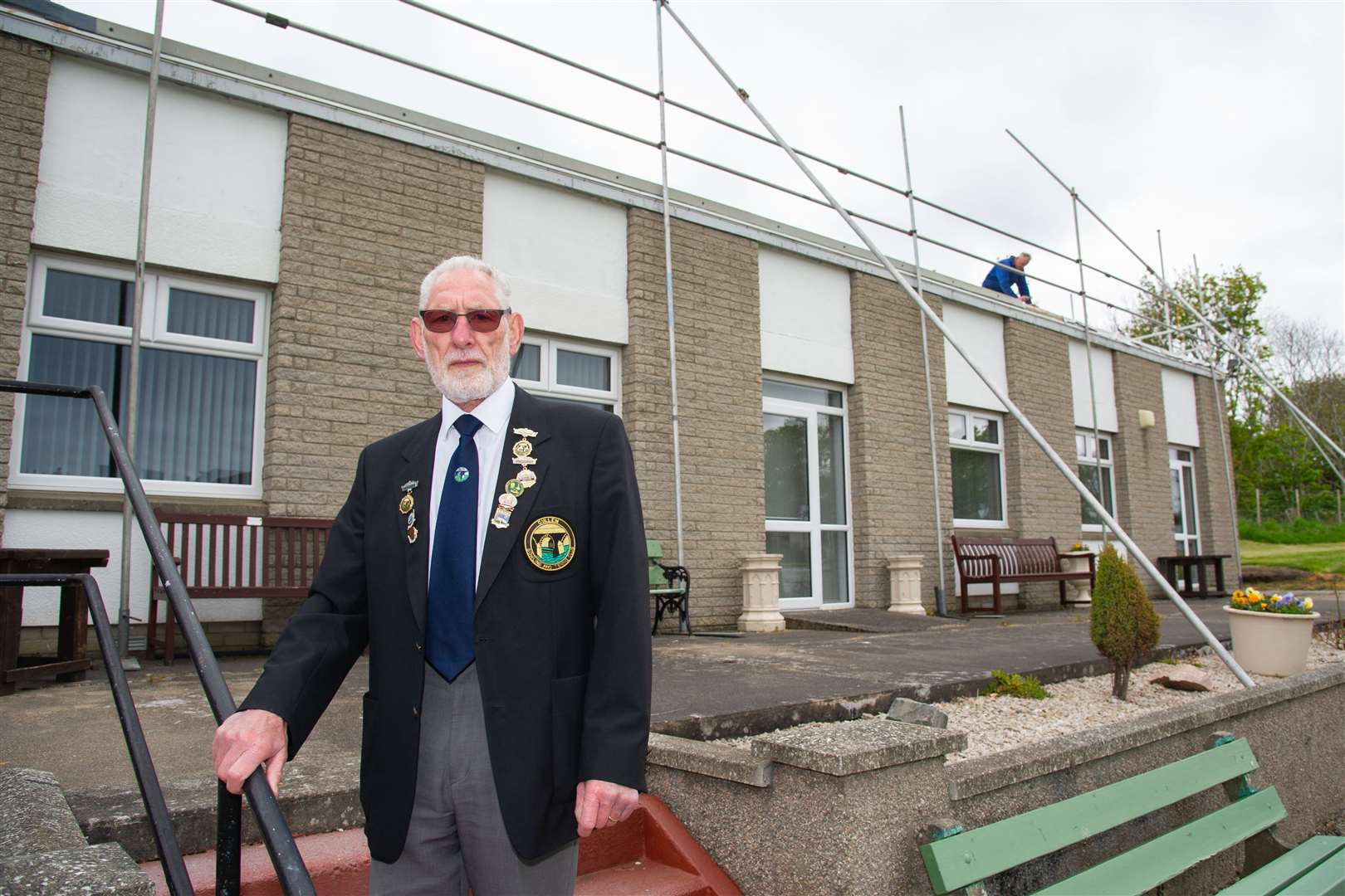 Cullen Bowling and Tennis Club president James Stewart oversees the repair work that has saved his club. Picture: Daniel Forsyth