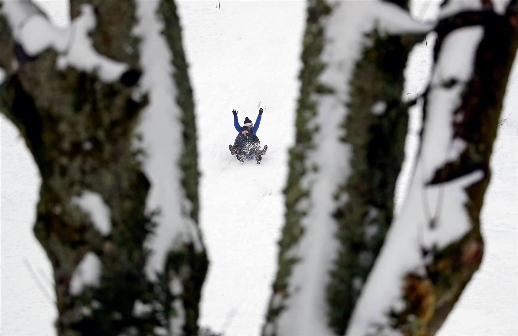 People sledging on the golf course at Gleneagles (Andrew Milligan/PA)