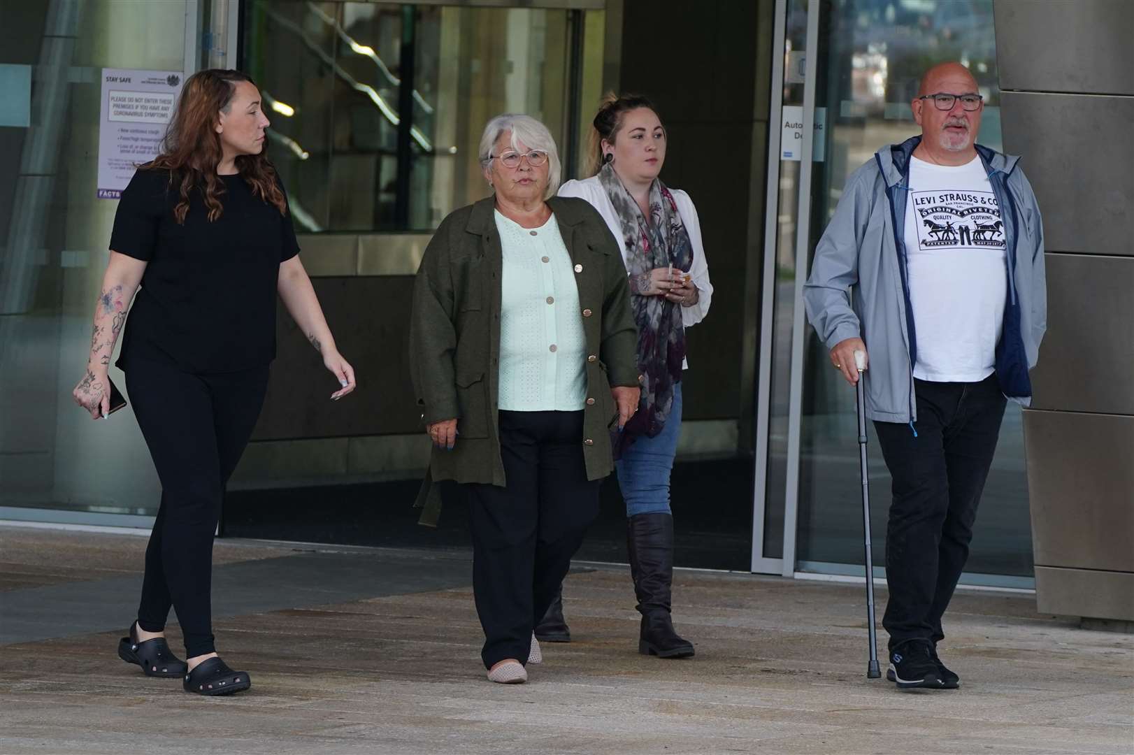 Amber Gibson’s foster parents, Carol Niven, second left, and Craig Niven outside the High Court in Livingston (Andrew Milligan/PA)