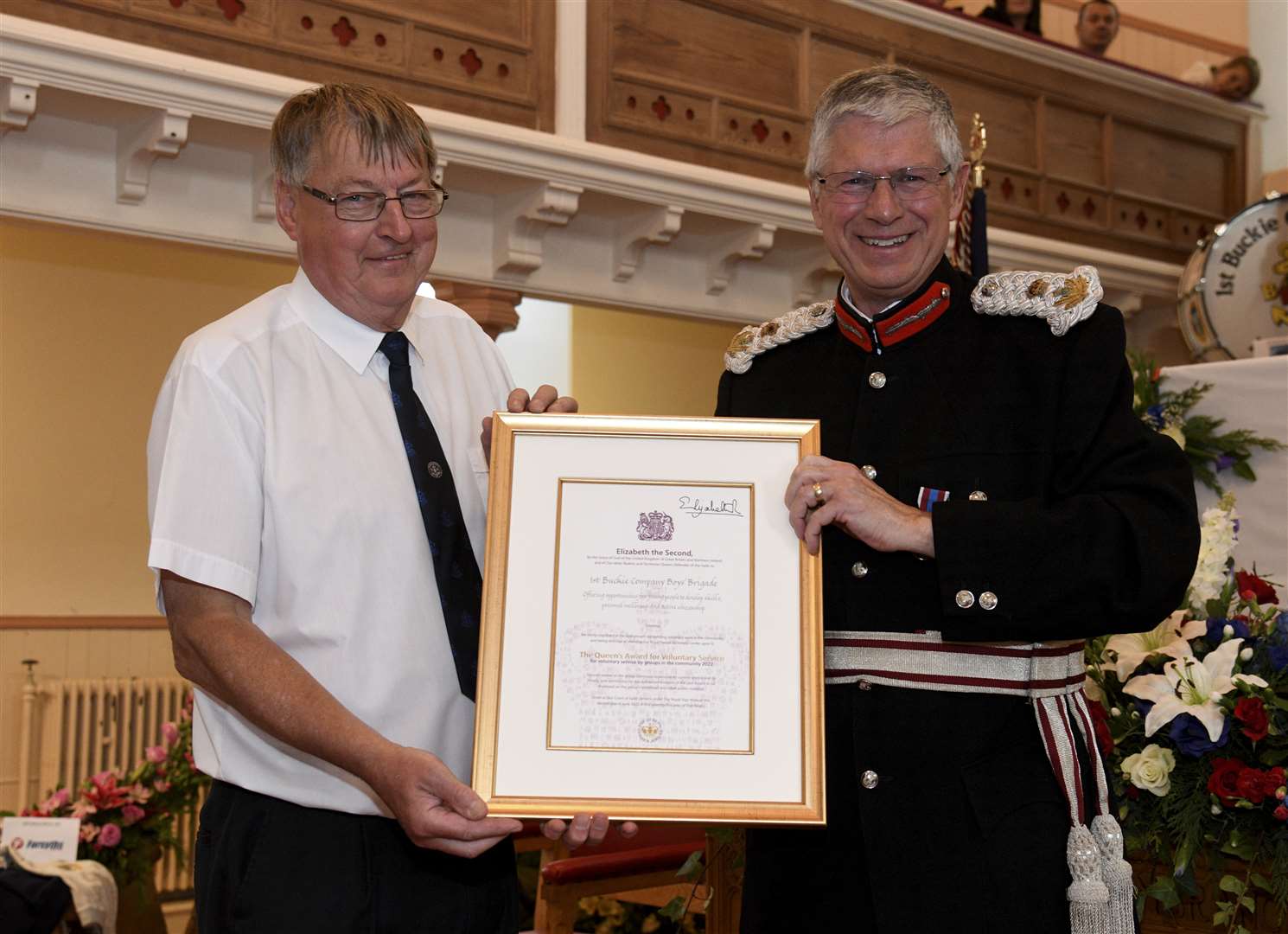 The Lord Lieutenant of Banffshire Andrew Simpson presents Captain Alan McIntosh with 1st Buckie Company's Queen's Award for Voluntary Service during the church service. Picture: Eric Cormack