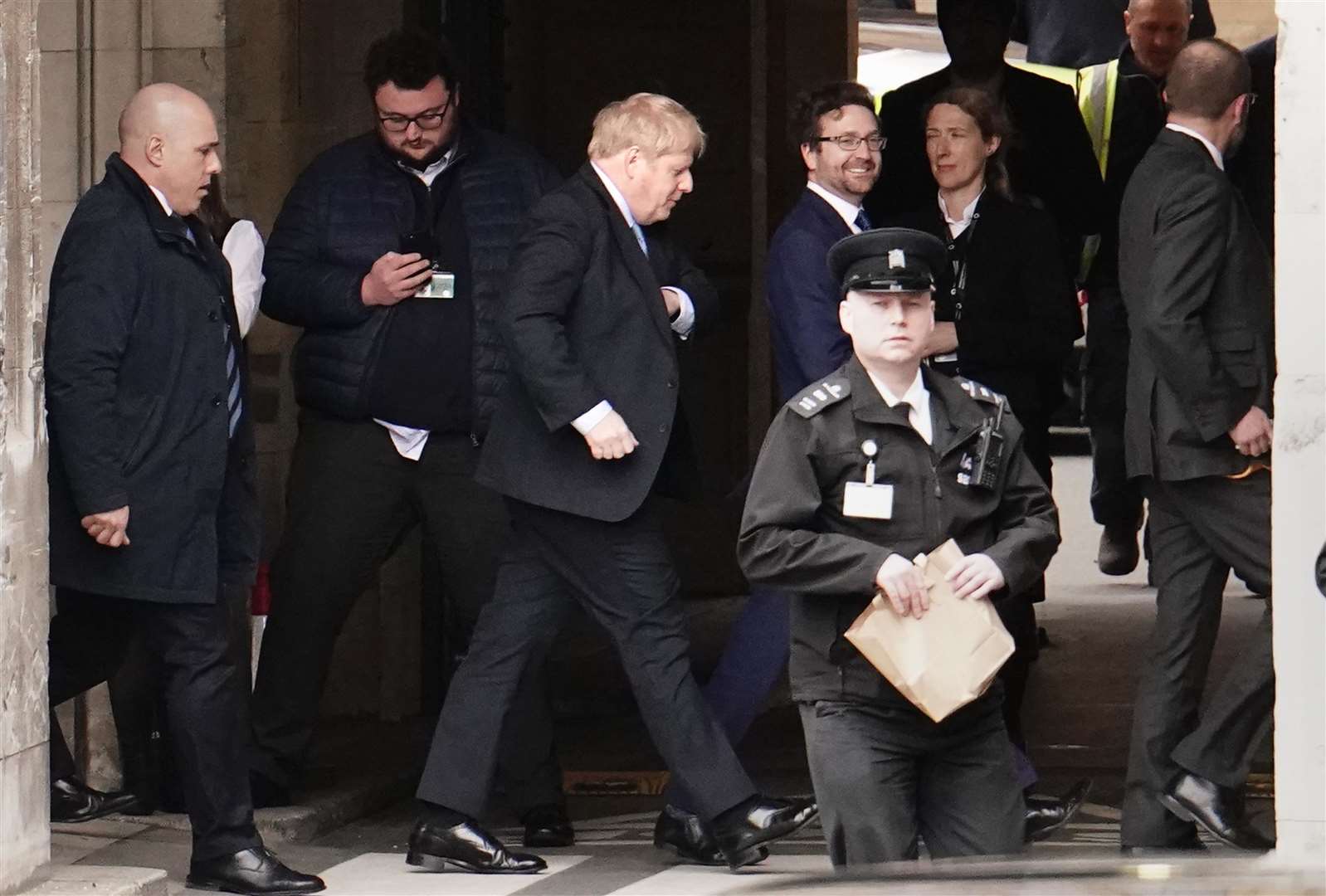 Former prime minister Boris Johnson (centre) leaves the Privileges Committee to vote in the House of Commons (Jordan Pettitt/PA)