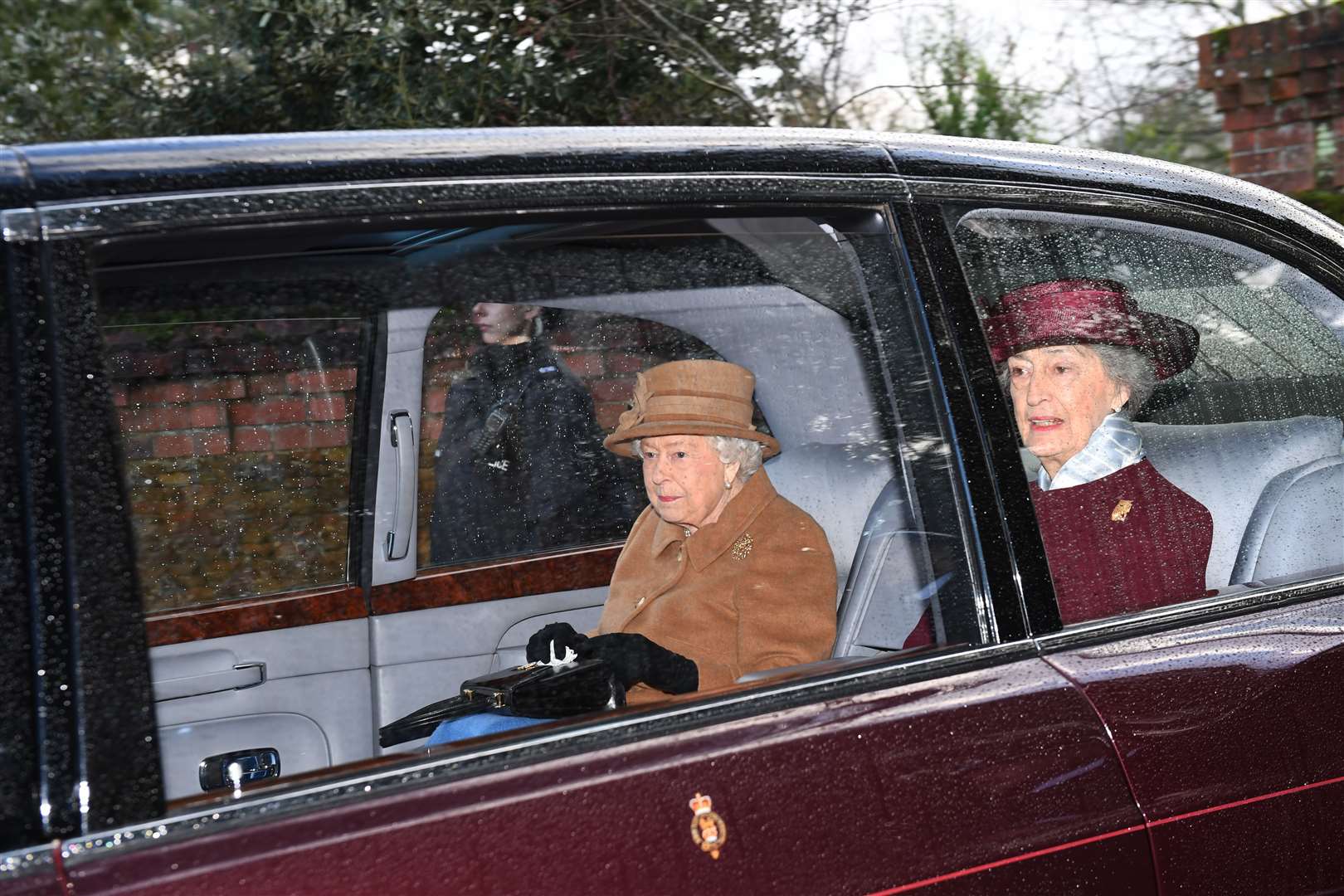 The Queen travelling with her then lady-in-waiting Lady Susan Hussey (Joe Giddens/PA)
