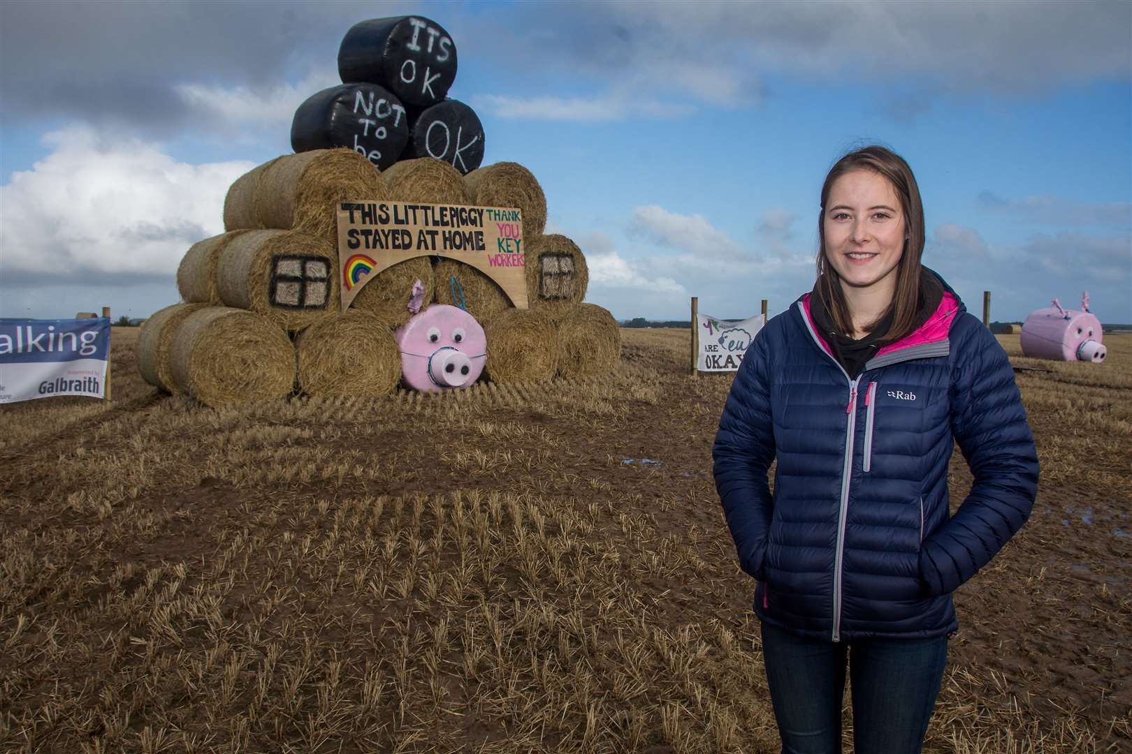 Lower Speyside Young Farmers member Ellie Newlands next to the club's 2020 bale art creation near Kinloss. Picture: Becky Saunderson.