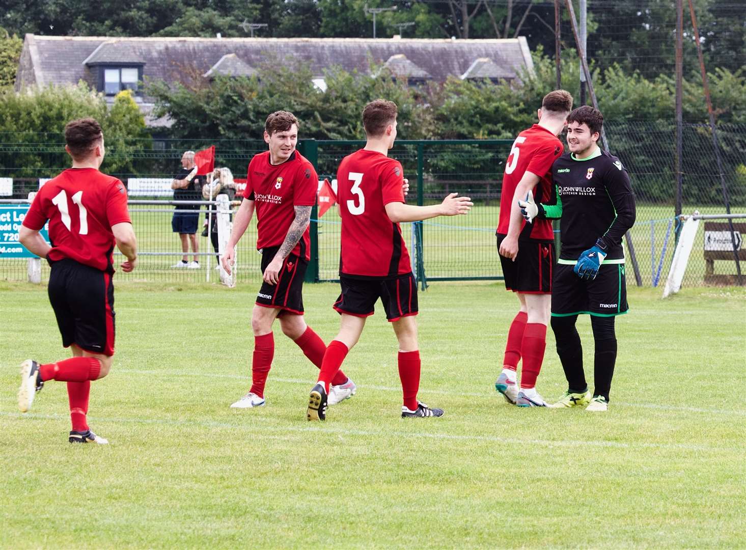 Ellon United keeper Elliot Wills is congratulated for scoring the opening goal. Picture: Phil Harman.