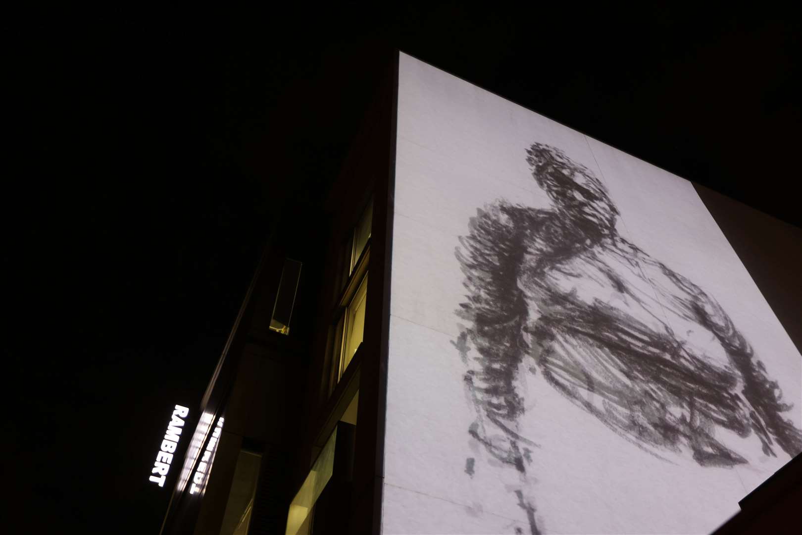 The projection of Dryden Goodwin’s artwork onto the Rambert building on London’s South Bank depicts Ms Adoo-Kissi-Debrah struggling to breathe (David Parry/PA)