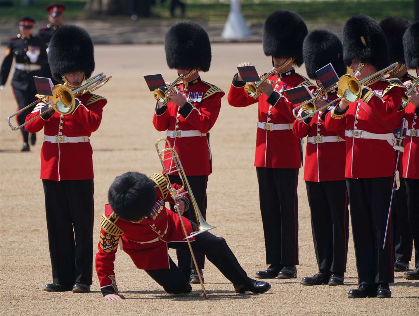 The heat proved difficult for one of the musicians in their heavy uniform (Jonathan Brady/PA)