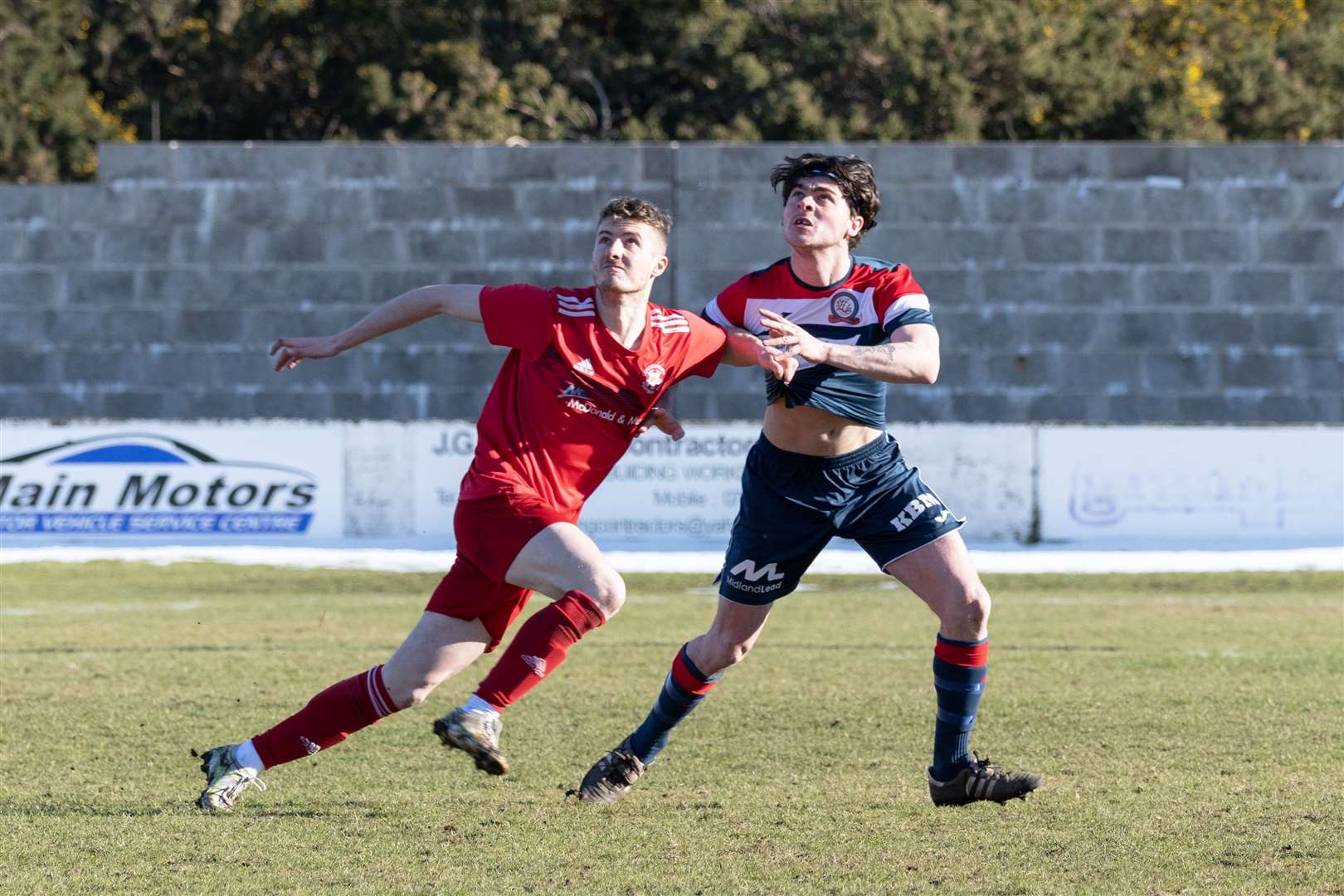 Liam Cheyne (right) in action for Turriff at Lossiemouth last season. Picture: Beth Taylor.