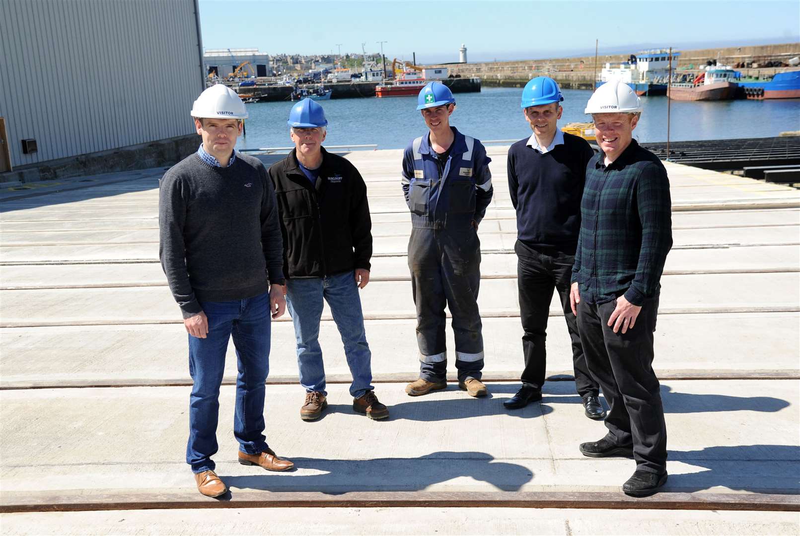 Douglas Ross MP (left) and Councillor Time Eagle (right) are shown the new slip facility at the shipyard by (from second left) Macduff Shipyards managing director John Watt, yard manager Stuart Mack and commercial manager Rory McCann. Picture: Eric Cormack. Image No.044321