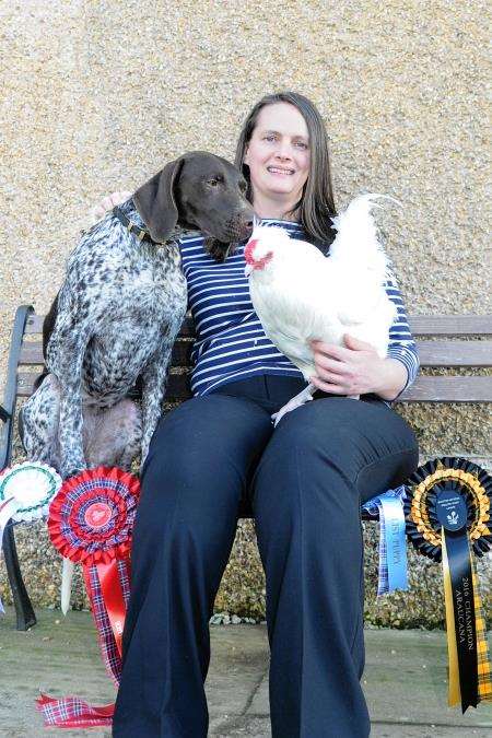 Katie Lindridge with Mia the puppy and Snowy the cockerel. Photo: Becky Saunderson